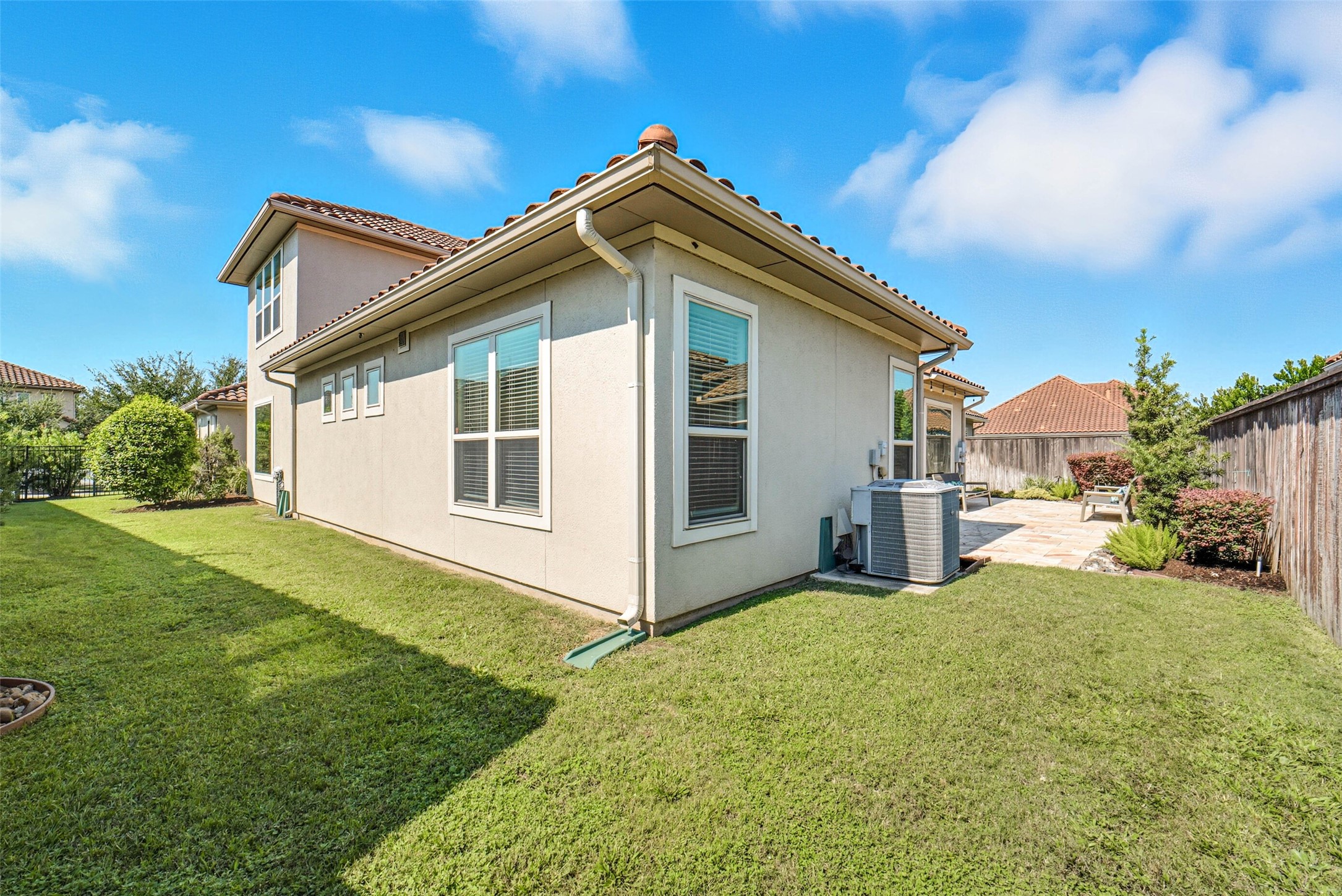 Side yard provides additional usable space for pets or children.