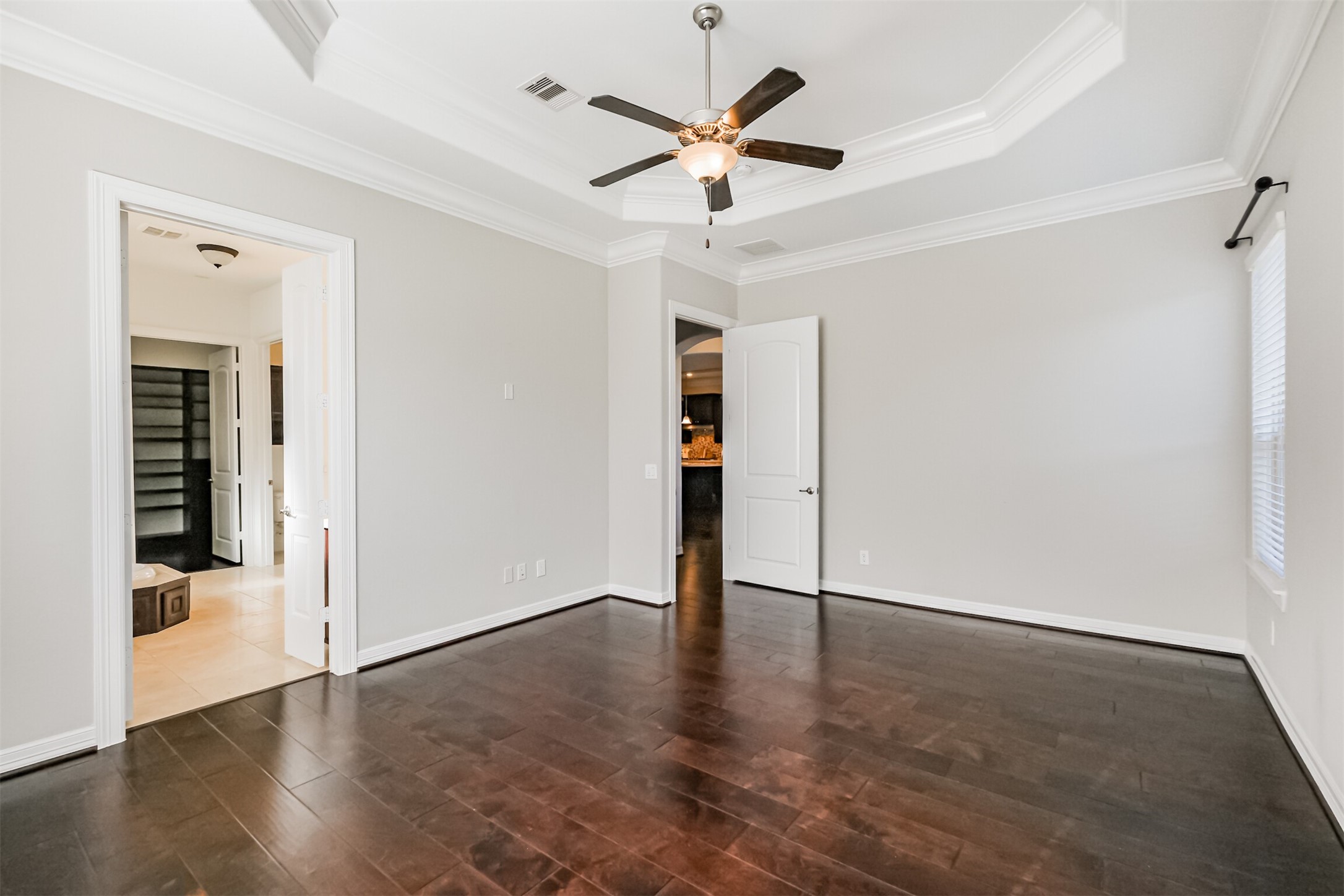 Another view of the secluded primary suite showing the location of the primary ensuite.