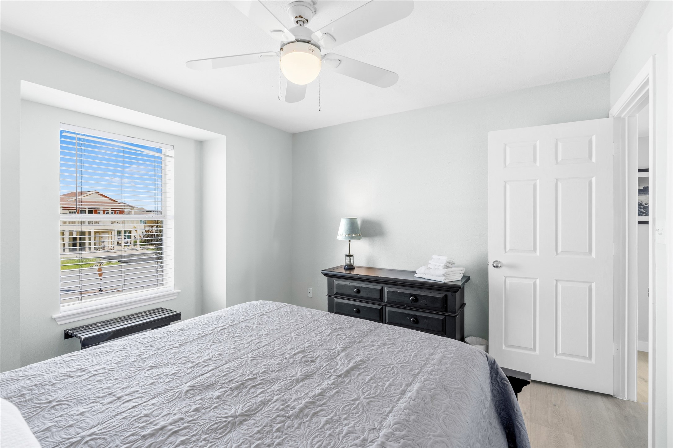 This bedroom features one large window with ample natural light.