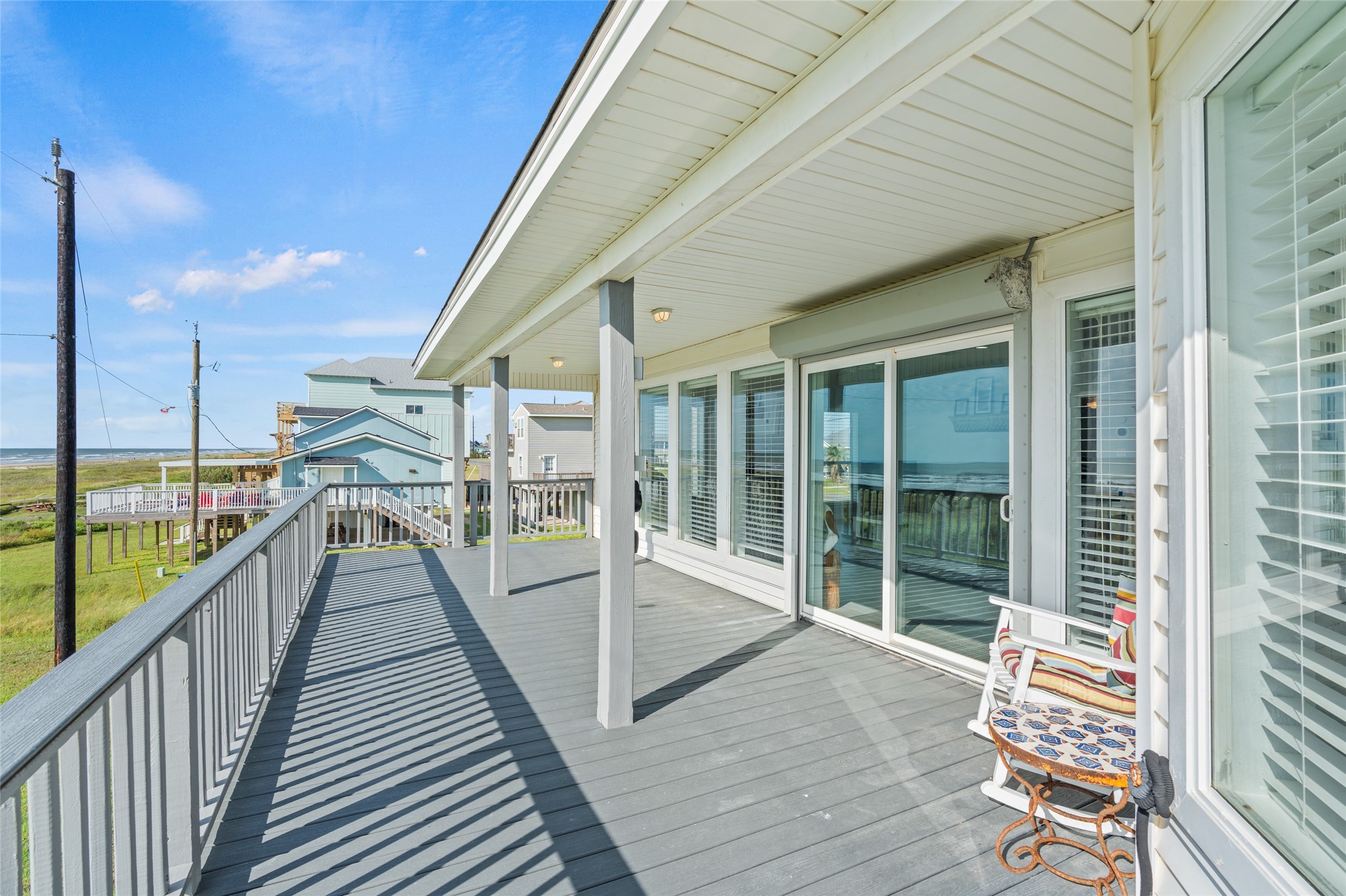 Beachfront deck is perfect for enjoying coastal breezes.