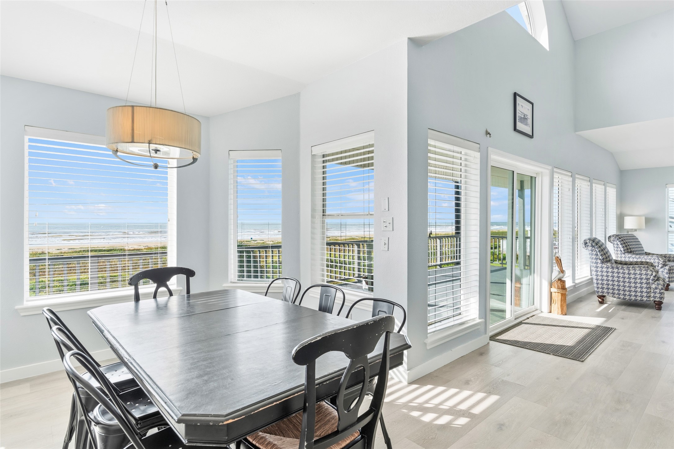 Enjoy the airy dining area with expansive views, featuring large windows and a seamless flow to the living space.