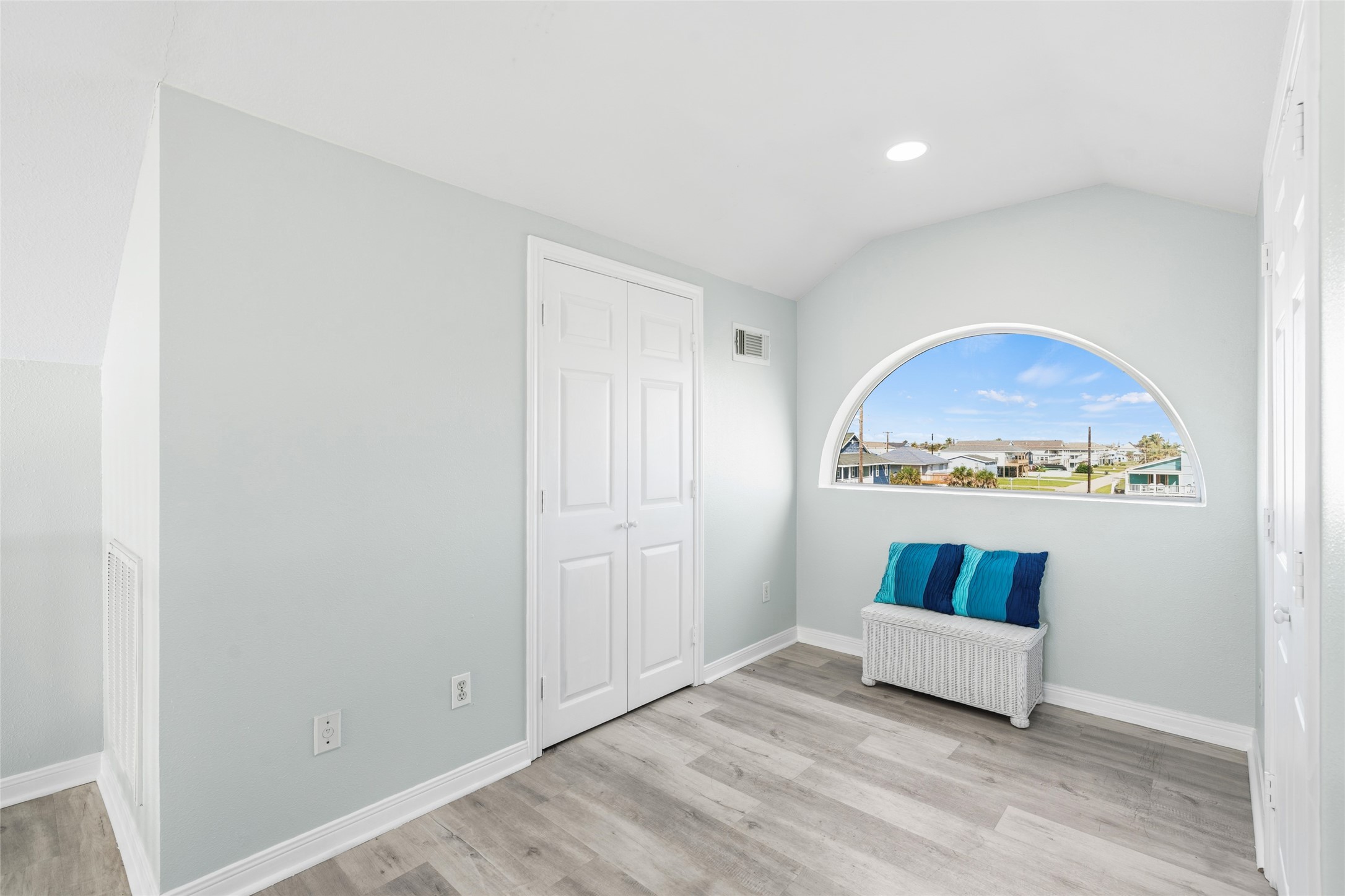 Bright room with scenic views is a cozy seating nook.