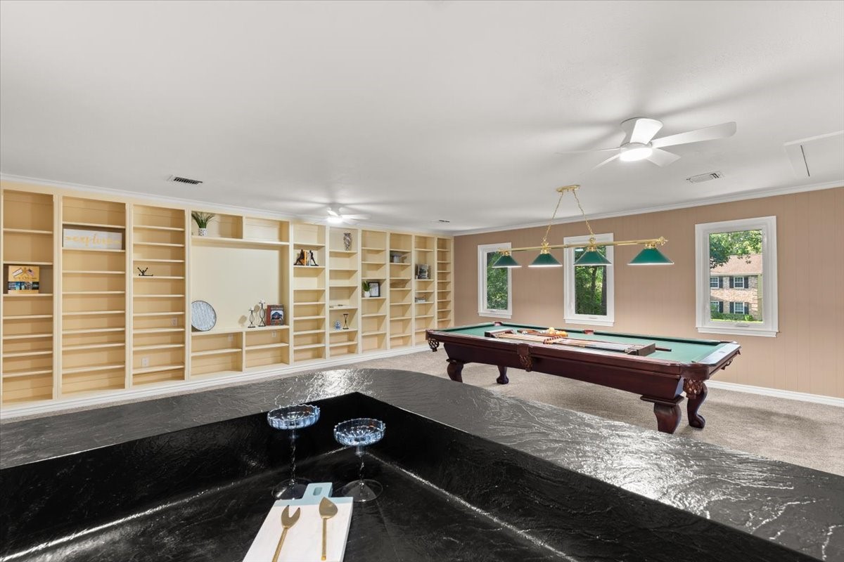 The gameroom has built in cabinets, a storage closet and a full wet-bar with space to add a refrigerator and more.