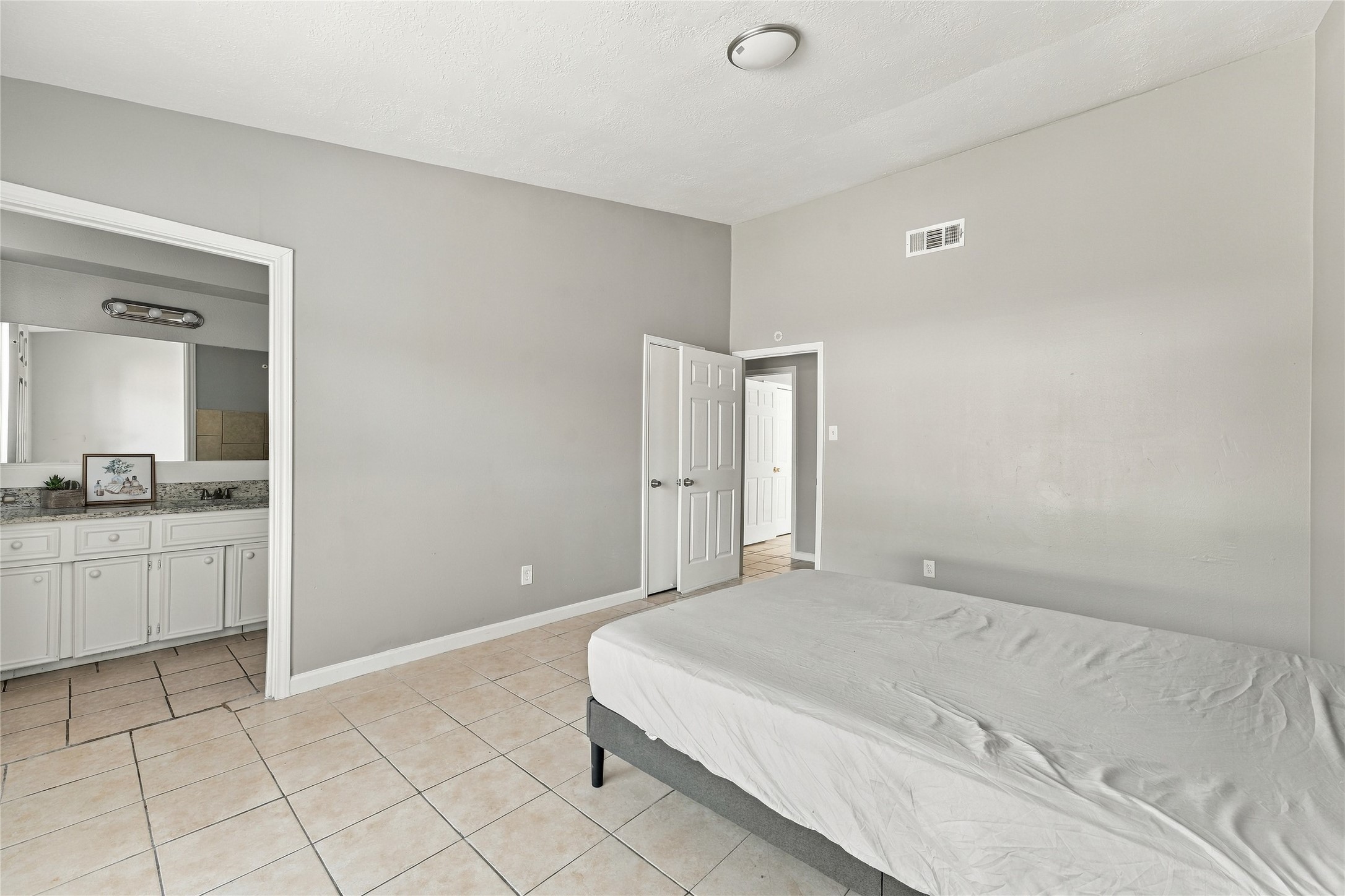Master bedroom offering generous space and abundant natural light.