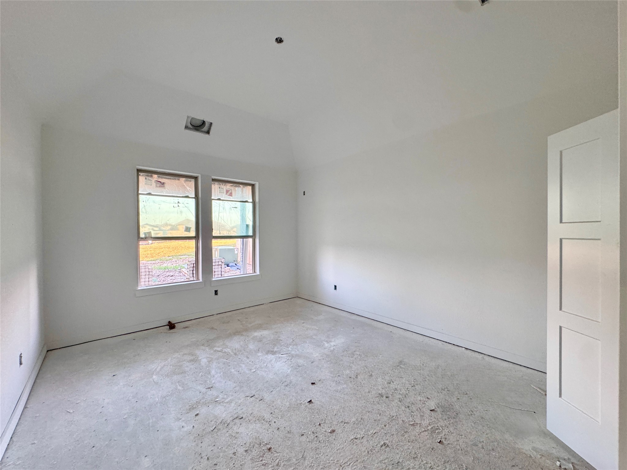The Primary Bedroom offers high vaulted ceilings!