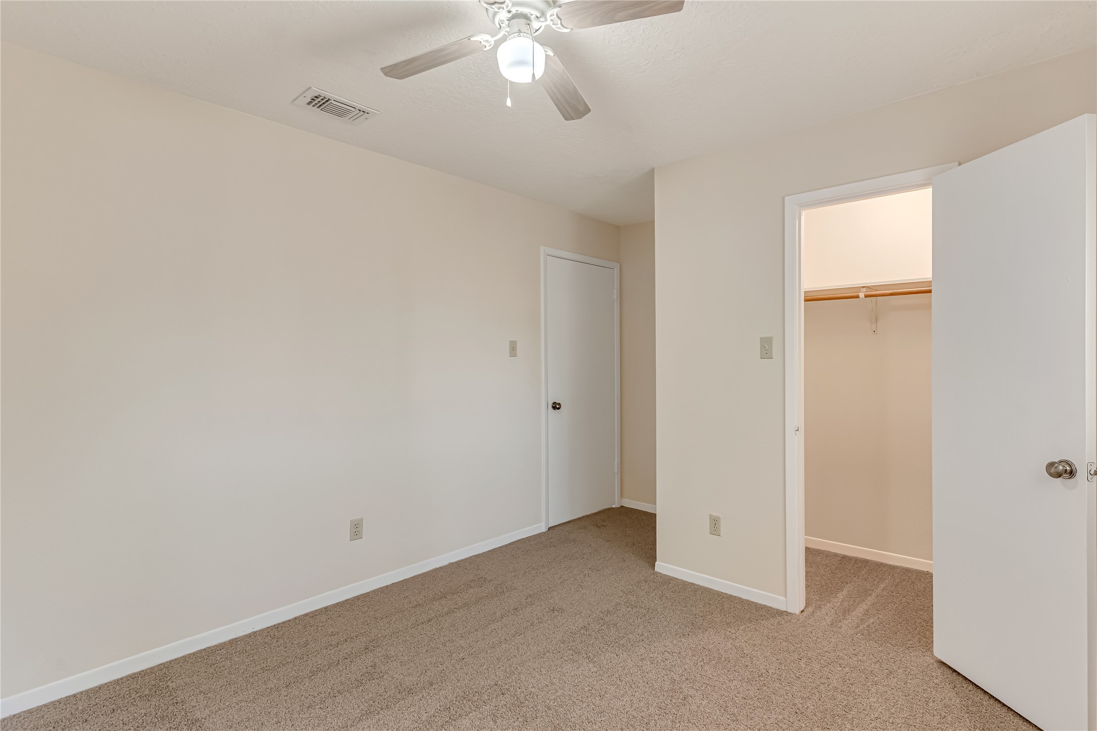 All guest bedrooms offer generous space and walk-in closets, providing comfort, functionality, and plenty of storage. Fresh paint, new carpet, and updated light fixtures give each room a clean, refreshed feel. These inviting spaces are ready to accommodate your lifestyle, whether you need restful retreats, guest accommodations, or a home office.