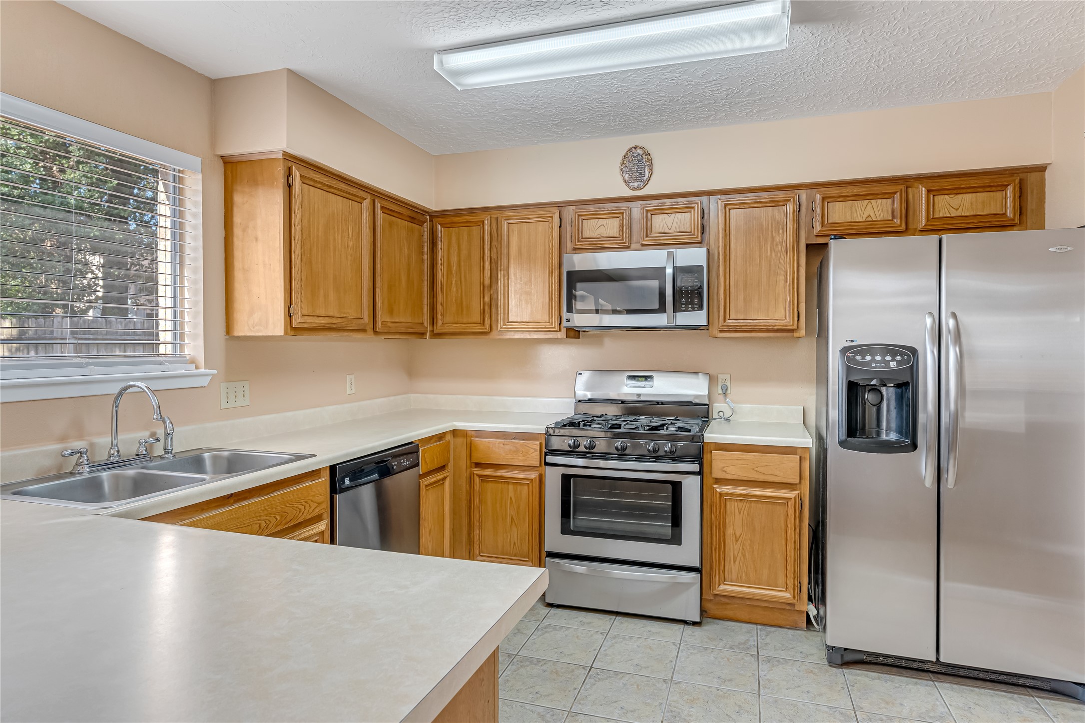 The chefs quarters feature recently updated stainless steel appliances, adding a fresh, modern touch to the kitchen. Perfect for preparing everyday meals or hosting family and friends, this inviting space combines style, functionality, and convenience. The chefs quarters feature recently updated stainless steel appliances, adding a fresh, modern touch to the kitchen. Perfect for preparing everyday meals or hosting family and friends, this inviting space combines style, functionality, and convenience.