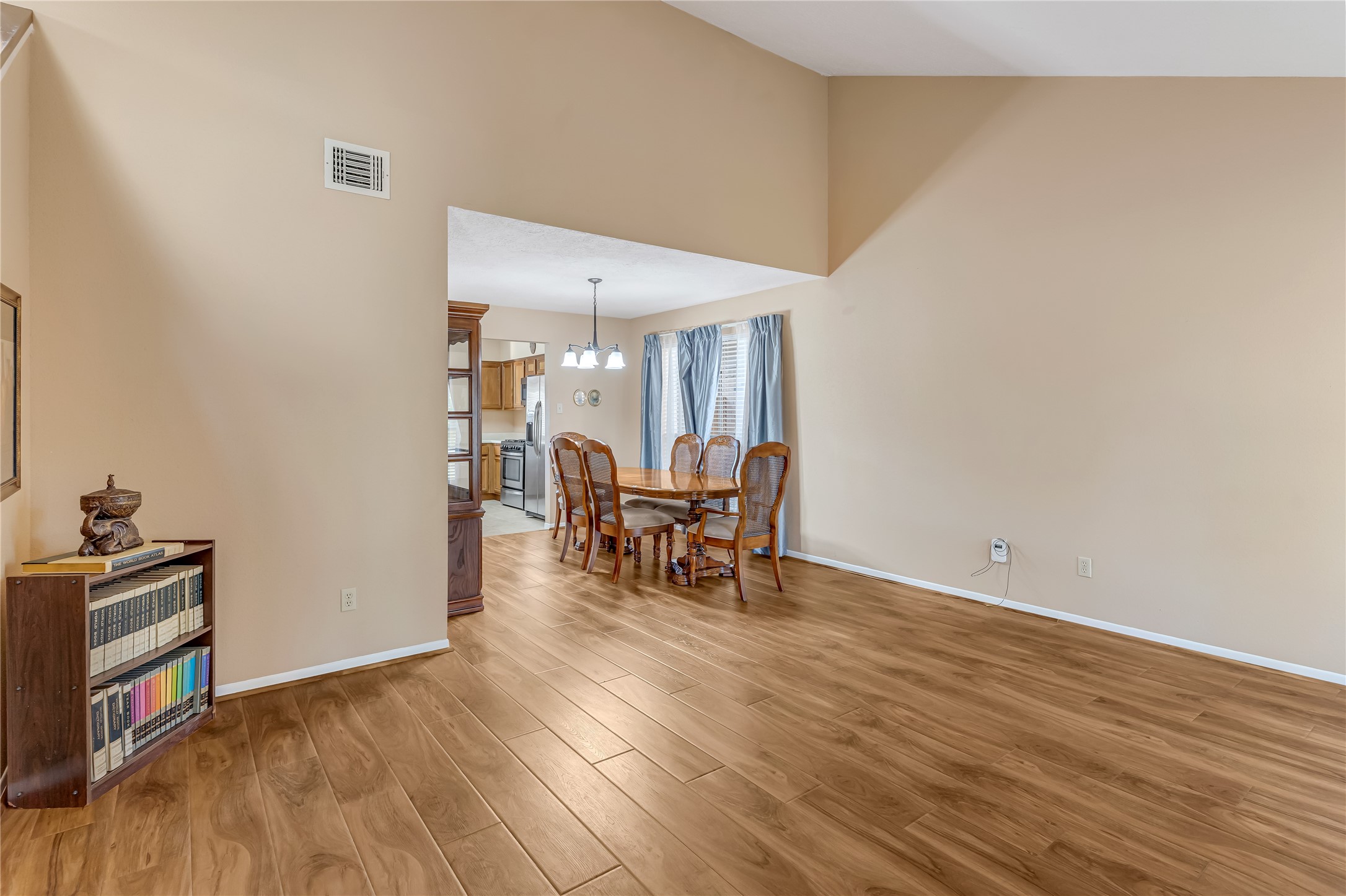 Fresh new paint and updated flooring throughout the home create a clean, modern feel. From the den, enjoy the open view into the formal dining room, showcasing a seamless flow between the two spaces. High ceilings enhance the spacious atmosphere, while the fresh finishes add a touch of style and sophistication. This inviting layout is perfect for entertaining, family gatherings, and comfortable everyday living. Fresh new paint and updated flooring throughout the home create a clean, modern feel. From the den, enjoy the open view into the formal dining room, showcasing a seamless flow between the two spaces. High ceilings enhance the spacious atmosphere, while the fresh finishes add a touch of style and sophistication. This inviting layout is perfect for entertaining, family gatherings, and comfortable everyday living.
