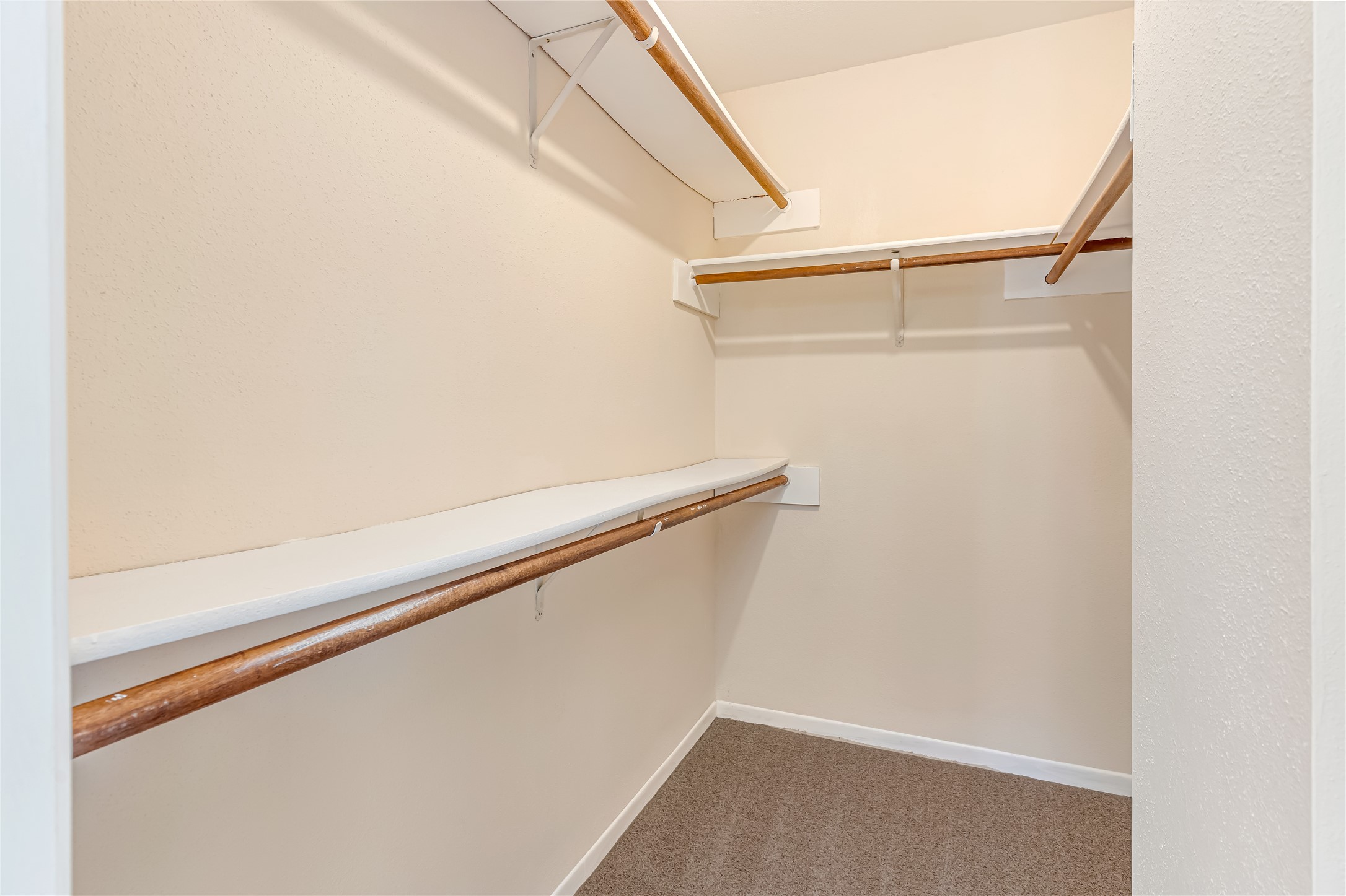 The spacious primary walk-in closet offers plenty of room to organize clothing, shoes, handbags, and everyday accessories. With ample storage space, this closet combines convenience and functionality, making it easy to keep your wardrobe organized and everything within reach.