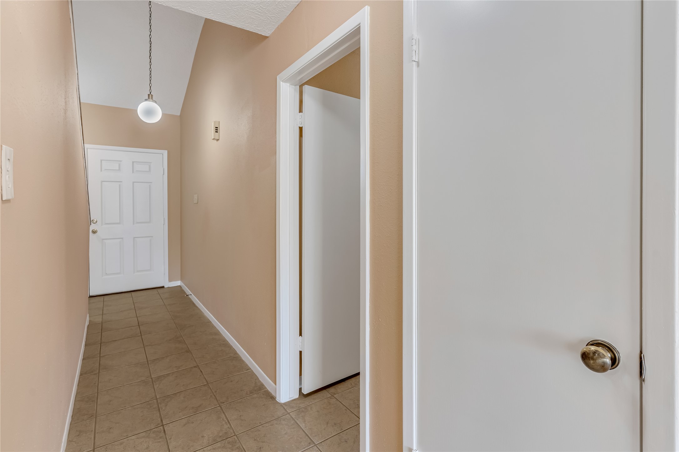 A wide, spacious hallway enhances the home's open feel, providing a comfortable flow between living spaces while creating a welcoming transition from one room to the next.