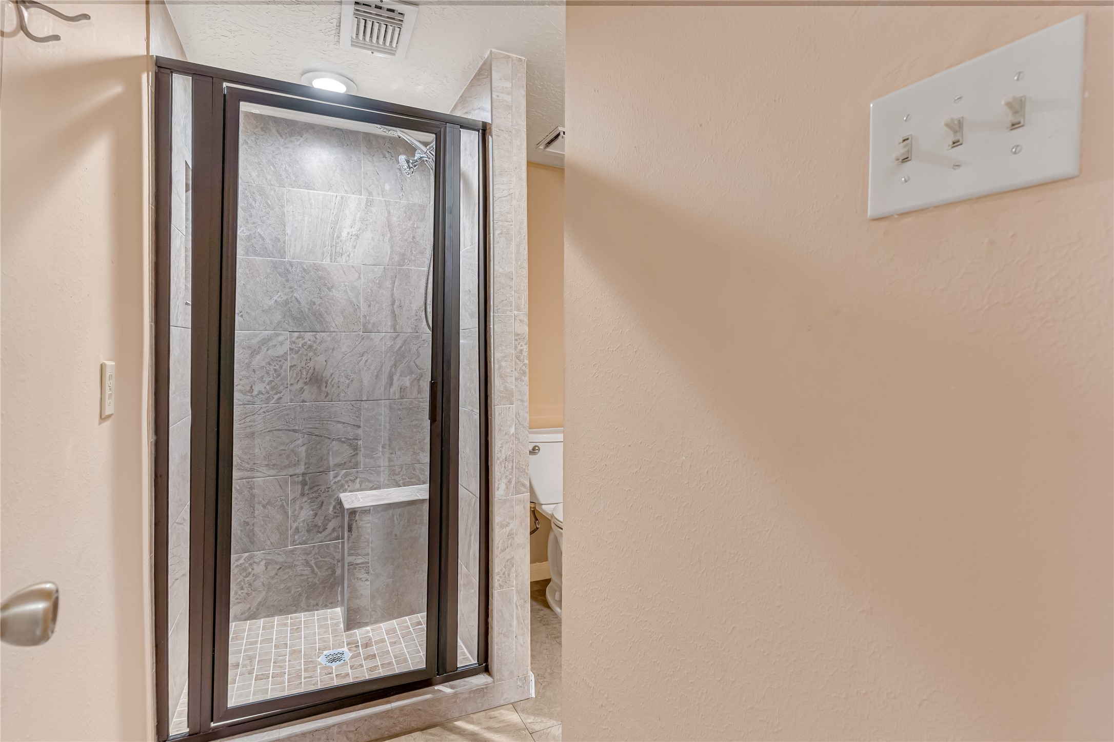 Downstairs Full bathroom - Stand up shower with seated area.