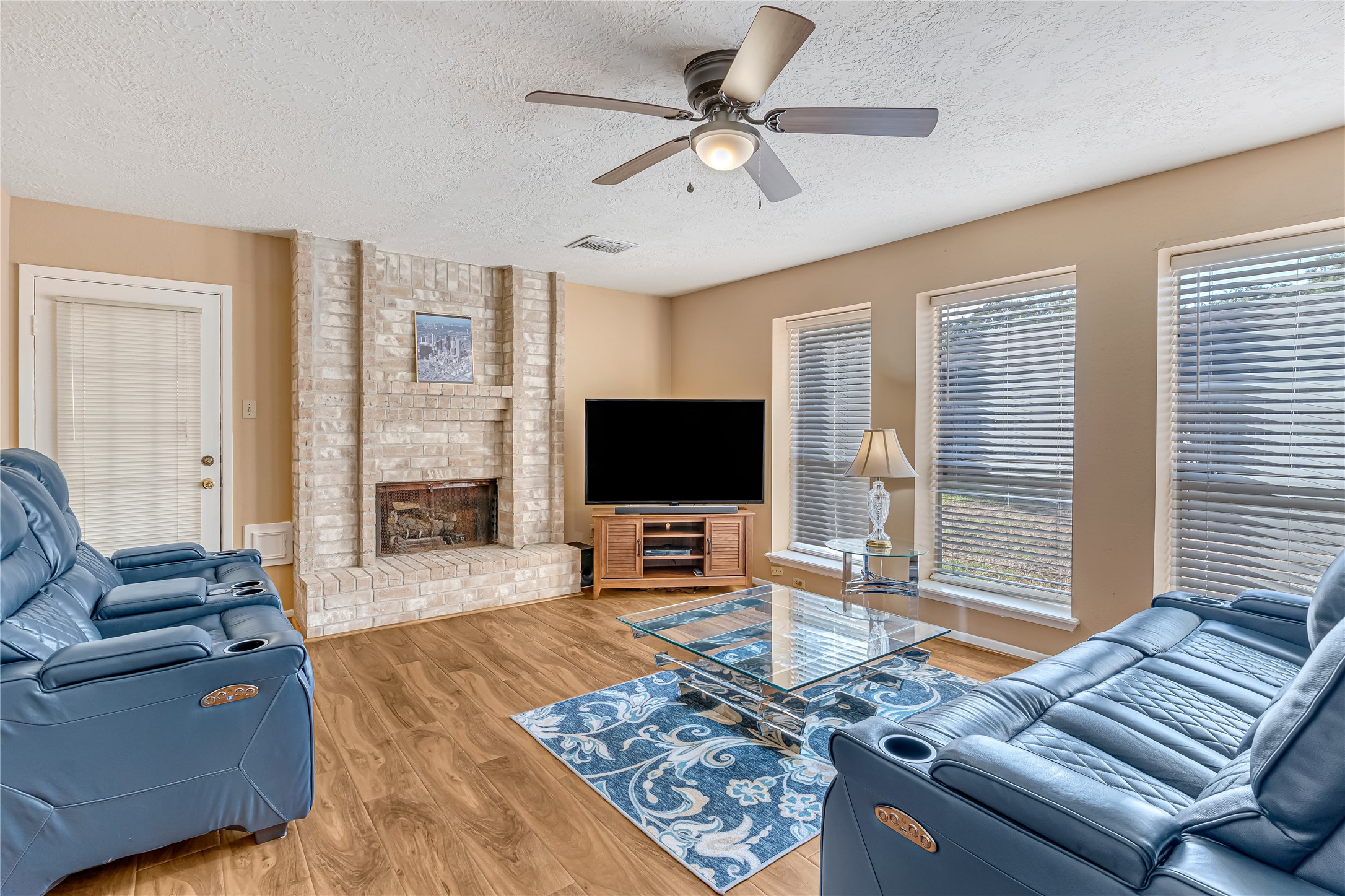 Welcome to a warm and inviting living room featuring a charming wood-burning fireplace, fresh paint, and updated flooring. This beautifully refreshed space offers the perfect setting for cozy evenings, family gatherings, and meaningful moments together. Imagine laughter filling the room, stories being shared by the fire, and memories being made that will last a lifetime. More than just a living space, this is where family connections grow and cherished memories begin. Welcome to a warm and inviting living room featuring a charming wood-burning fireplace, fresh paint, and updated flooring. This beautifully refreshed space offers the perfect setting for cozy evenings, family gatherings, and meaningful moments together. Imagine laughter filling the room, stories being shared by the fire, and memories being made that will last a lifetime. More than just a living space, this is where family connections grow and cherished memories begin.