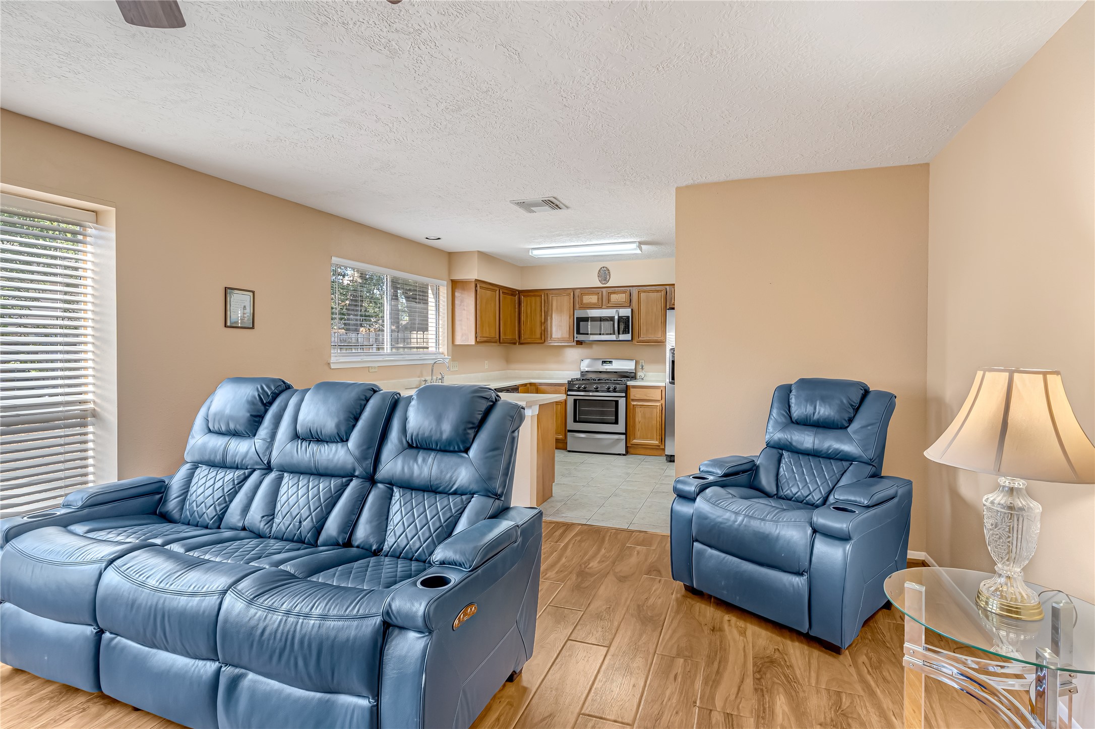 Welcome to a warm and inviting living room featuring a charming wood-burning fireplace, fresh paint, and updated flooring. This beautifully refreshed space offers the perfect setting for cozy evenings, family gatherings, and meaningful moments together. Imagine laughter filling the room, stories being shared by the fire, and memories being made that will last a lifetime. More than just a living space, this is where family connections grow and cherished memories begin. Welcome to a warm and inviting living room featuring a charming wood-burning fireplace, fresh paint, and updated flooring. This beautifully refreshed space offers the perfect setting for cozy evenings, family gatherings, and meaningful moments together. Imagine laughter filling the room, stories being shared by the fire, and memories being made that will last a lifetime. More than just a living space, this is where family connections grow and cherished memories begin.