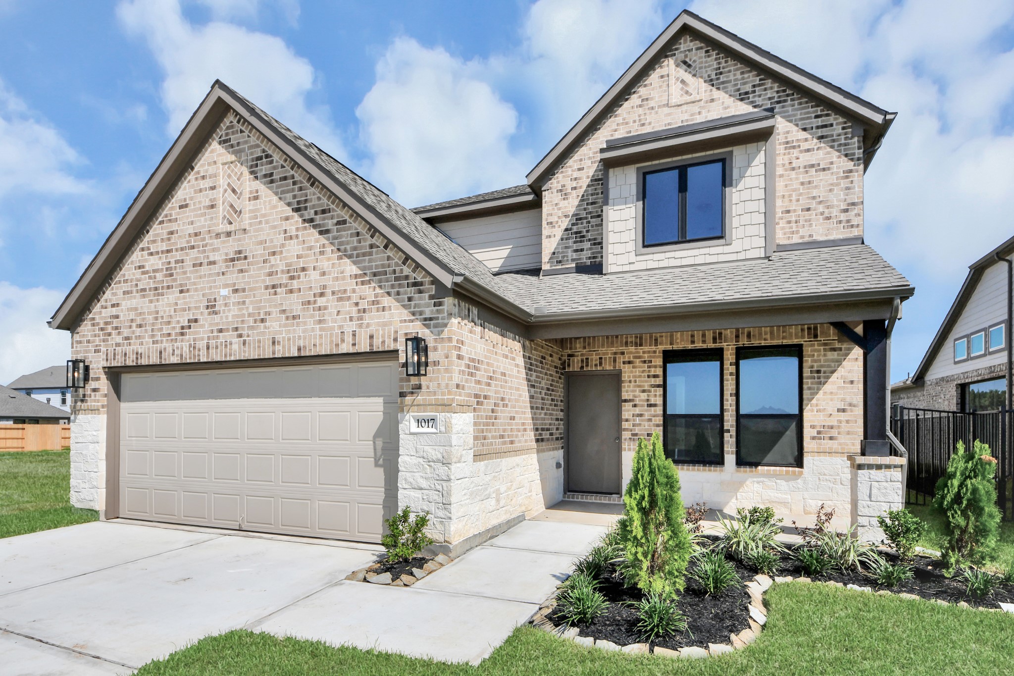 Home features a convenient 2-car garage complemented by a spacious driveway, offering ample parking for you and your guests.