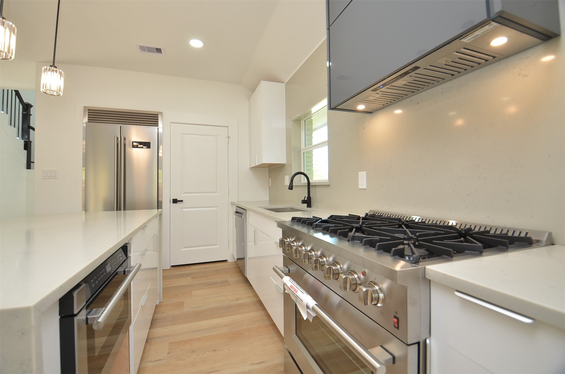 Chef's Kitchen offers a Large Quartzite island w/waterfall edge
