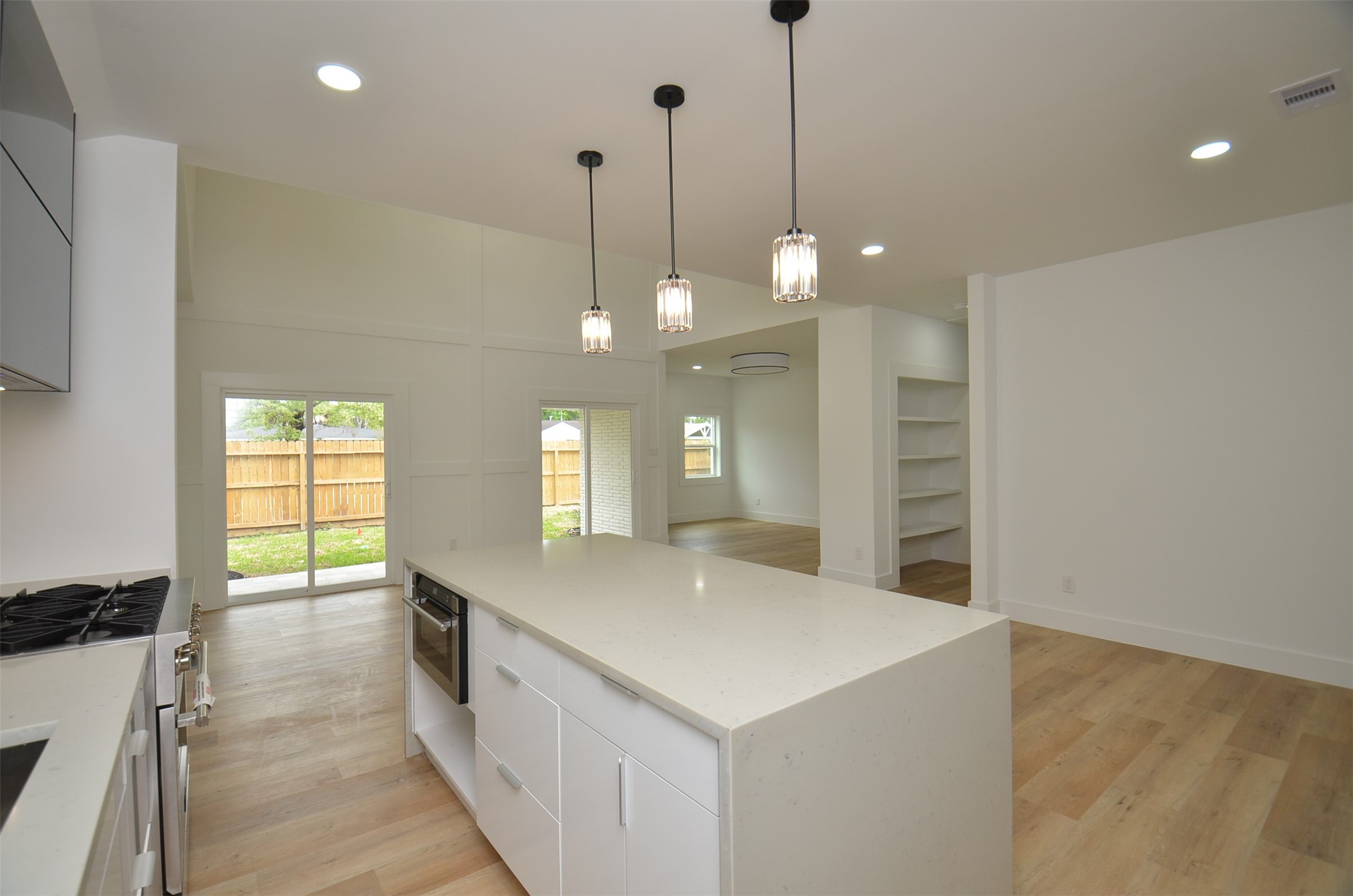Bright, open-concept Kitchen featuring a spacious island, quartz countertops, and seamless flow for cooking and entertaining