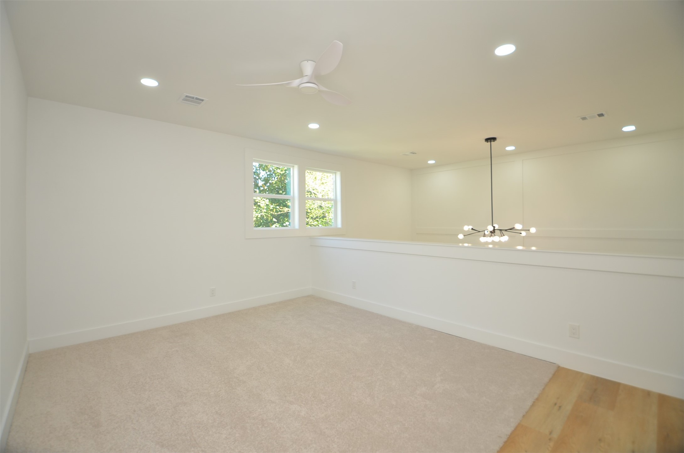 Spacious upstairs game room with High Ceilings.