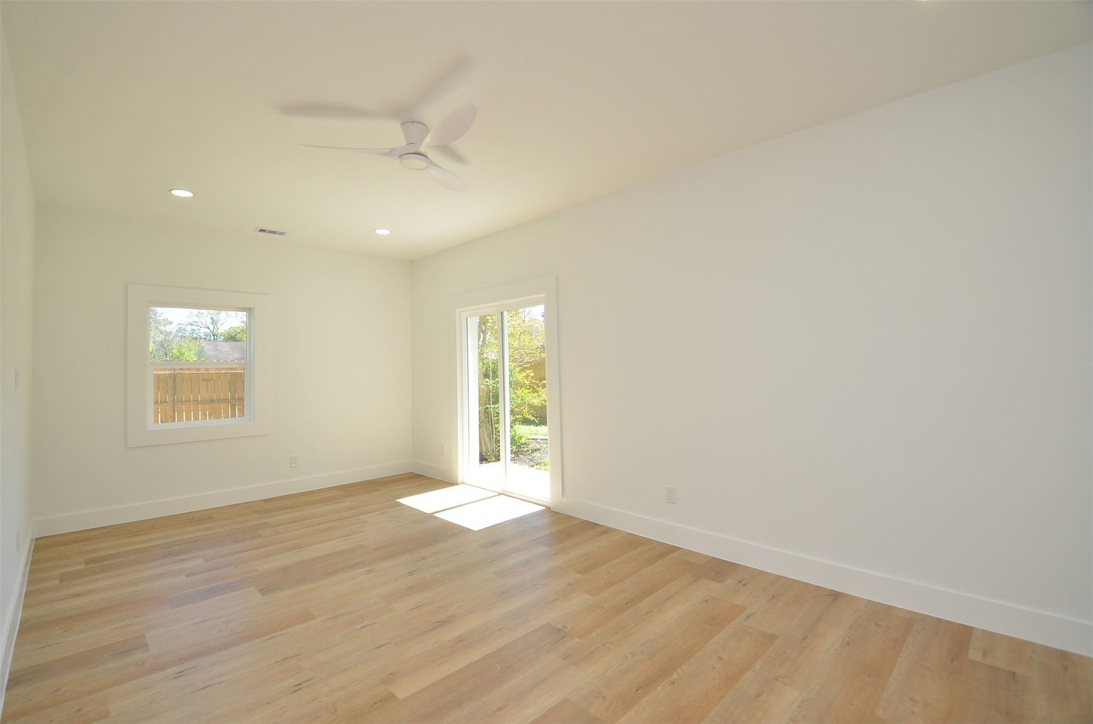 Serene primary suite, with abundant light and spacious layout