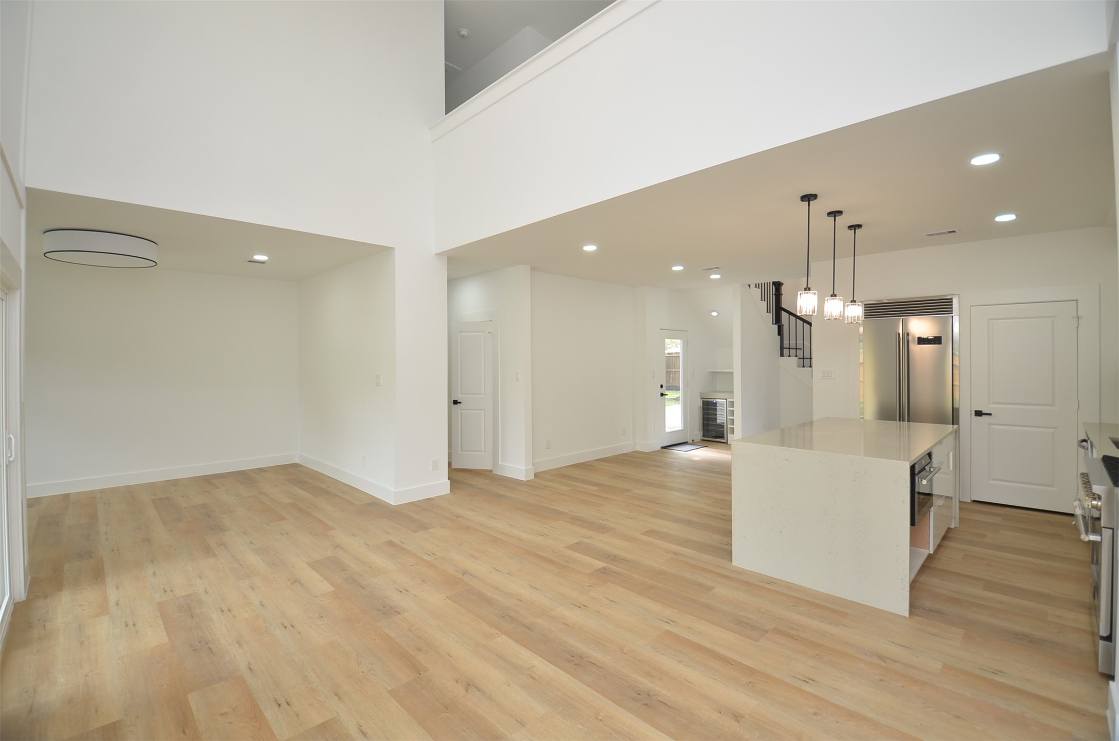 Spacious living area with High Ceilings, open to the Kitchen.