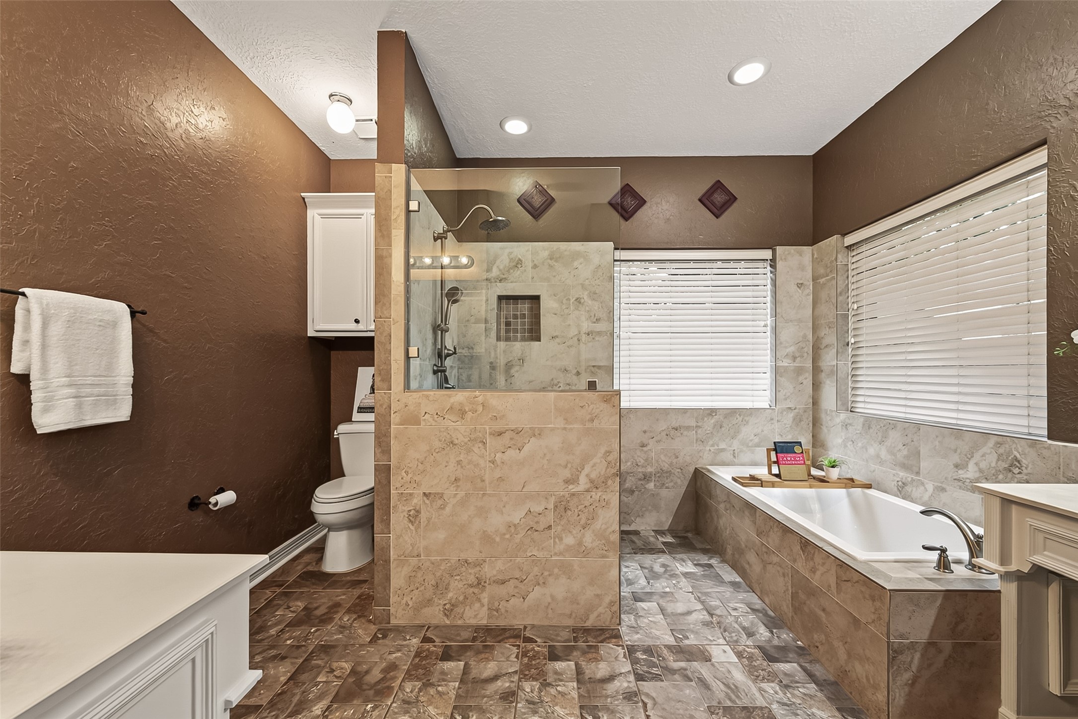 updated Primary Bathroom with a large walk-in shower and separate garden tub