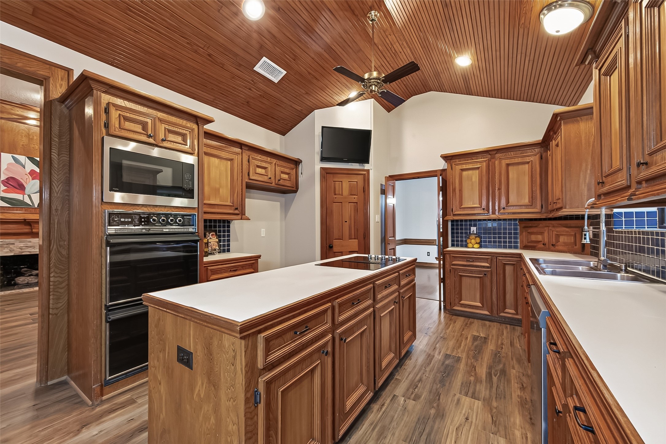 Large Island Kitchen with double ovens and custom woodwork on the ceiling. Large Island Kitchen with double ovens and custom woodwork on the ceiling.