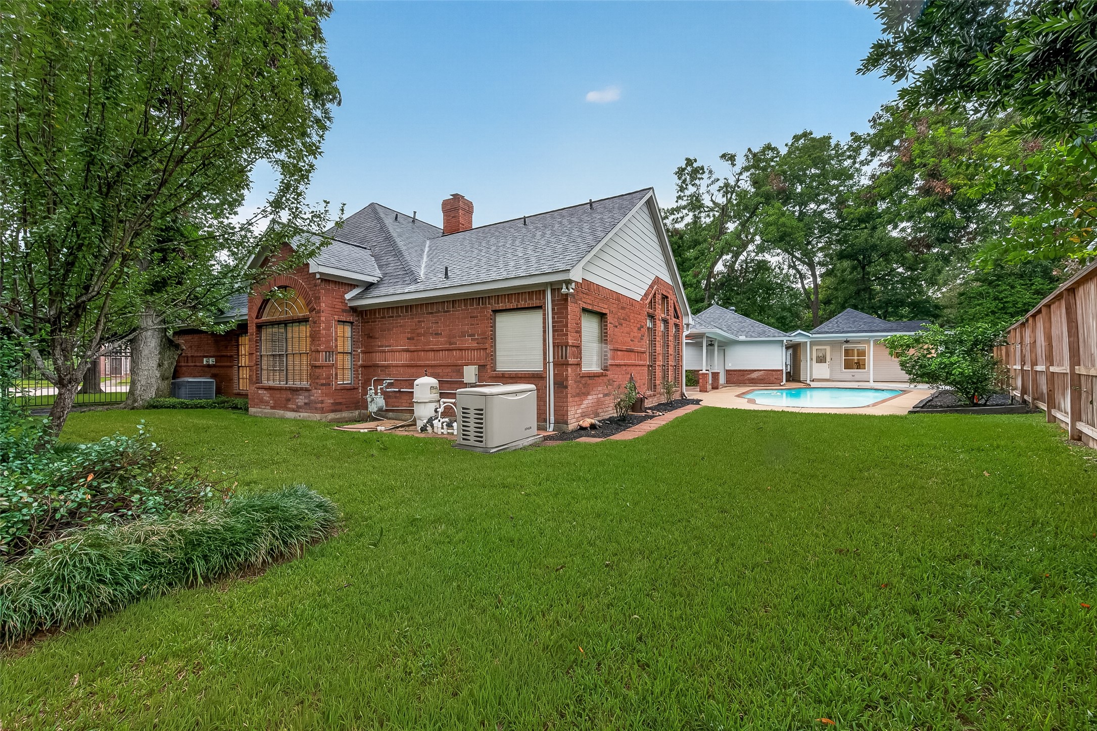 The Backyard is Huge and includes all this extra grass area in addition to the Pool and 650sqft guest Qtrs.  Full House Generator too!