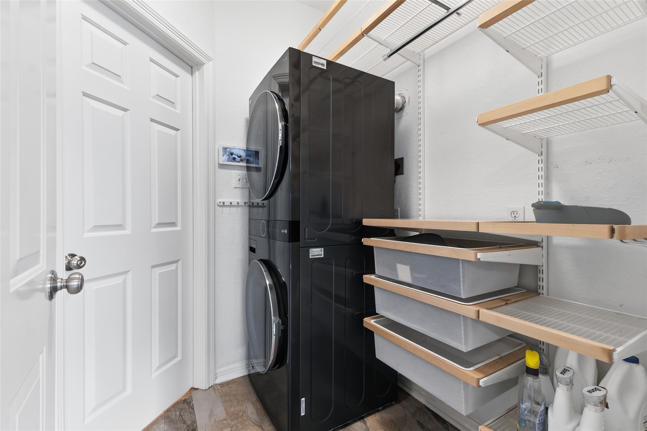Functional laundry room with custom storage unit.