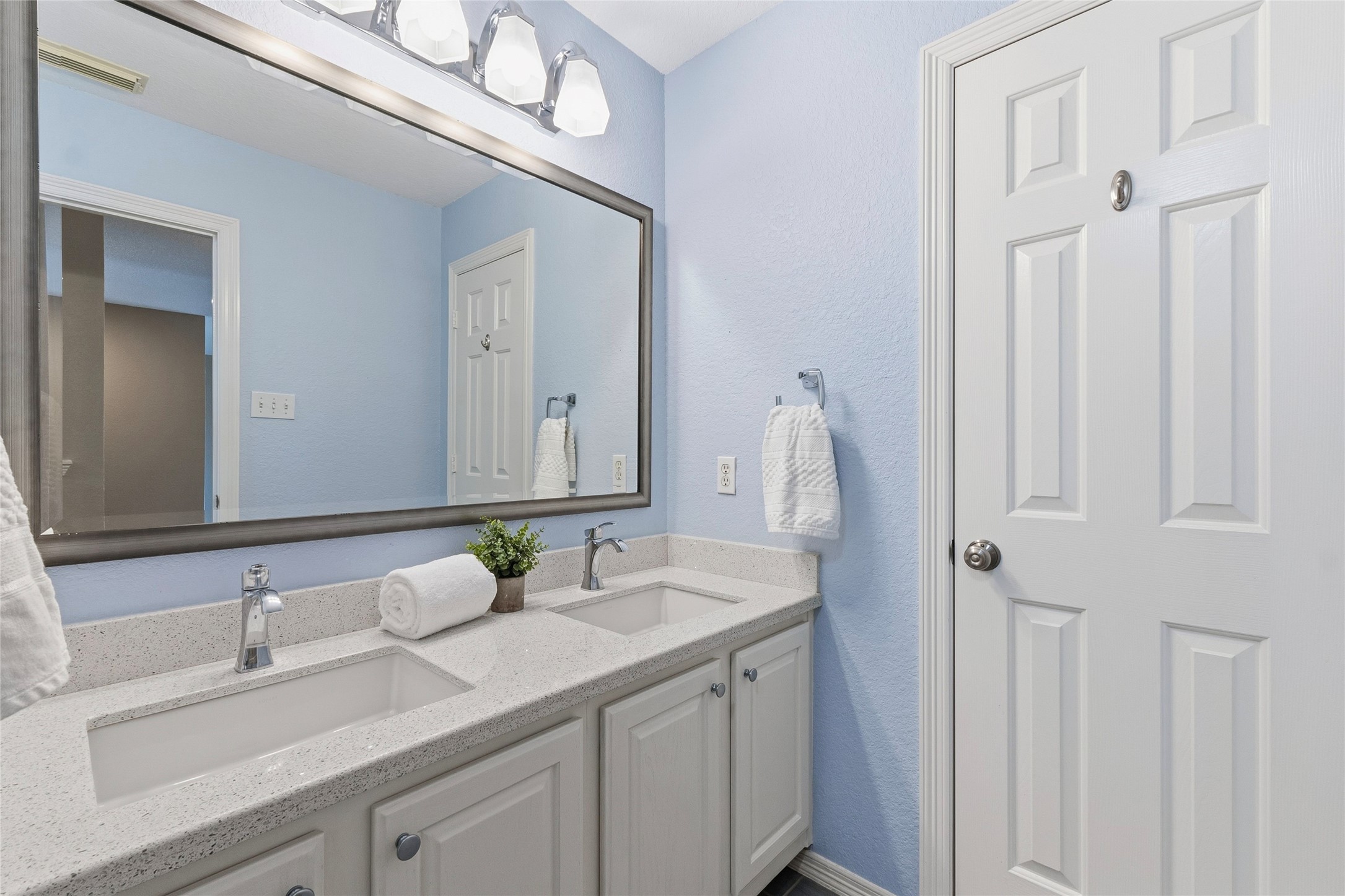 Updated Full Bath upstairs with dual sinks and quartz countertops.