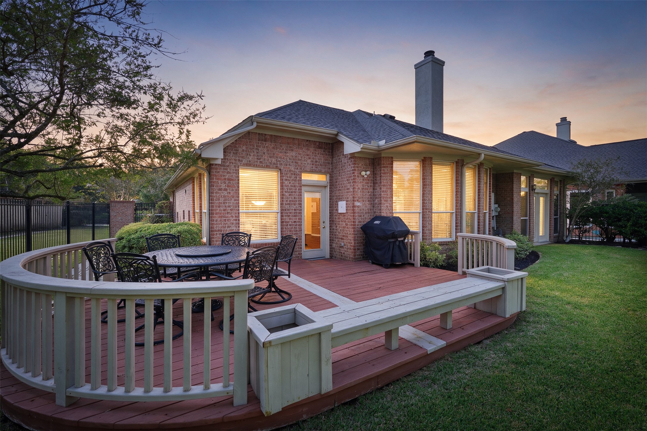Back deck, full gutters and pristine landscaping are just a few of the features of this yard.