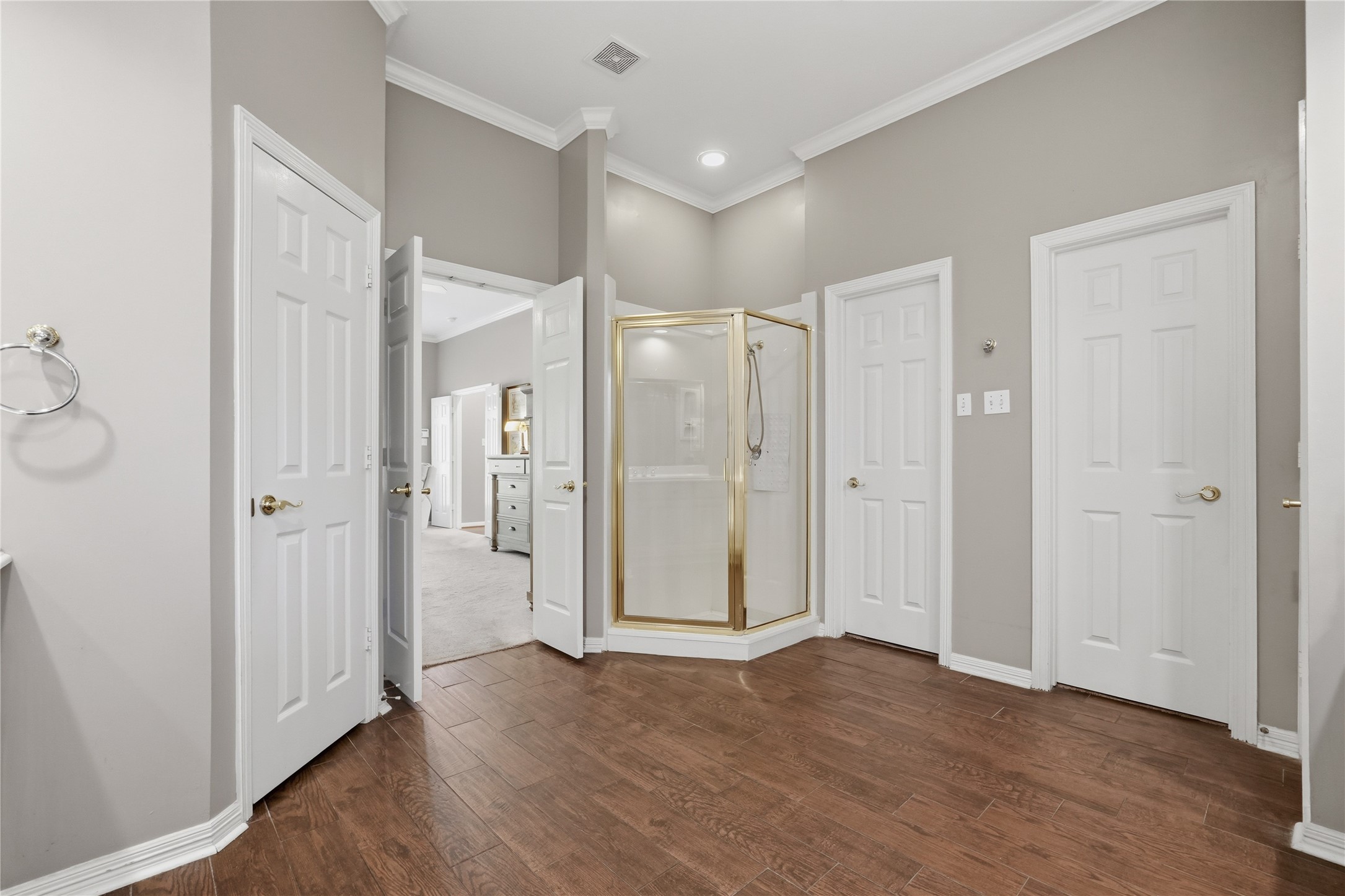 Primary bathroom with his and hers closets.