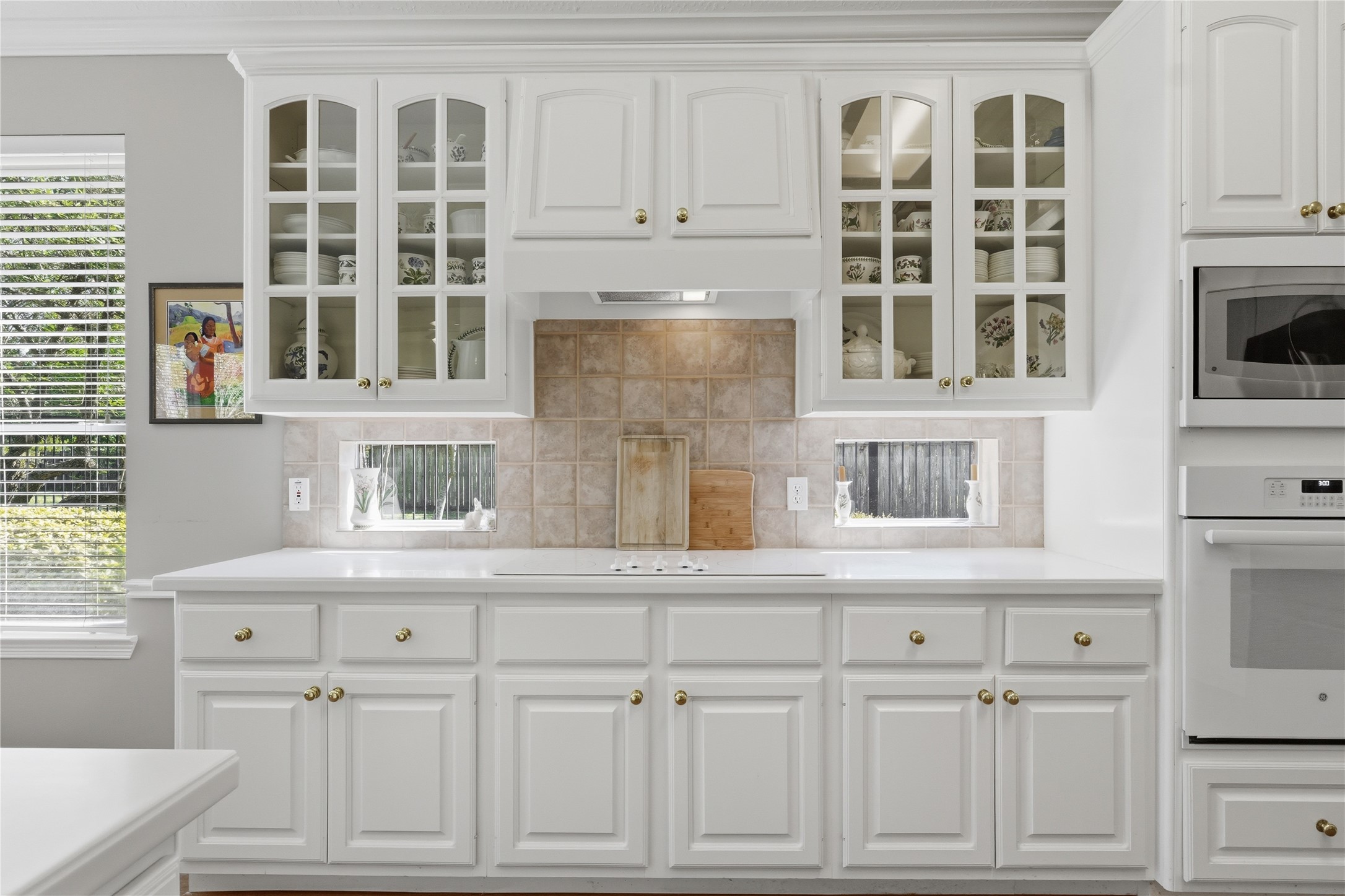 Beautiful display cabinets and don't miss the small windows underneath to allow natural light to pour in!