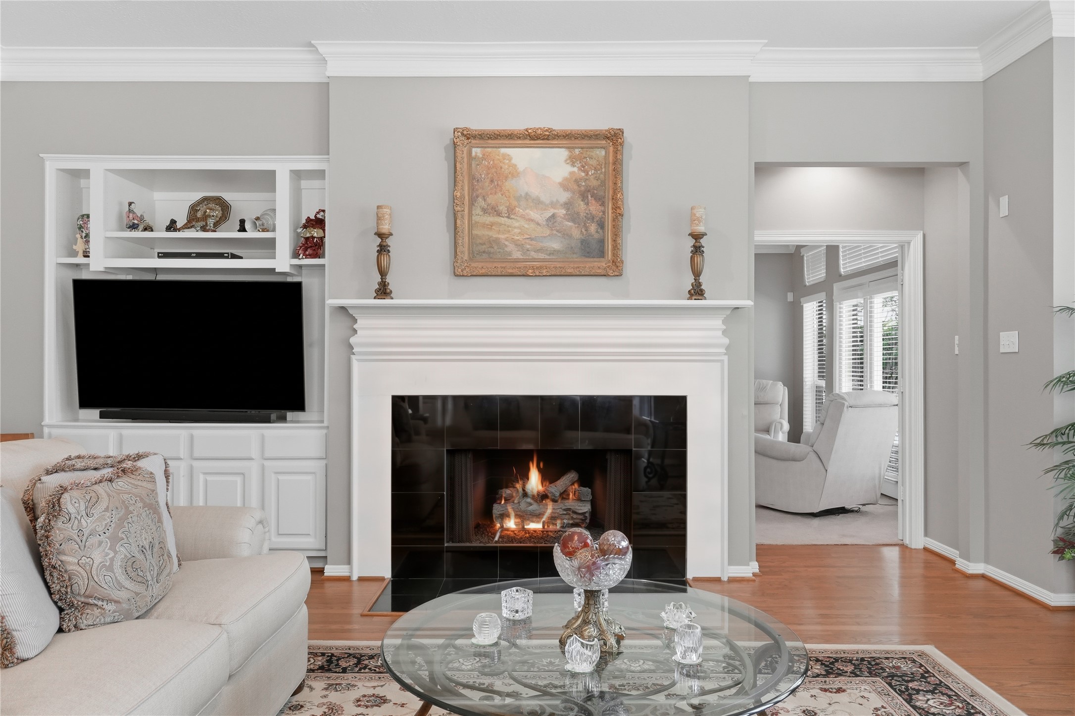 The large living room has a fireplace as the focal point.