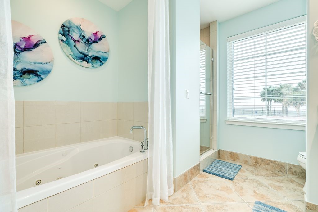 Primary bathroom with tub and separate shower