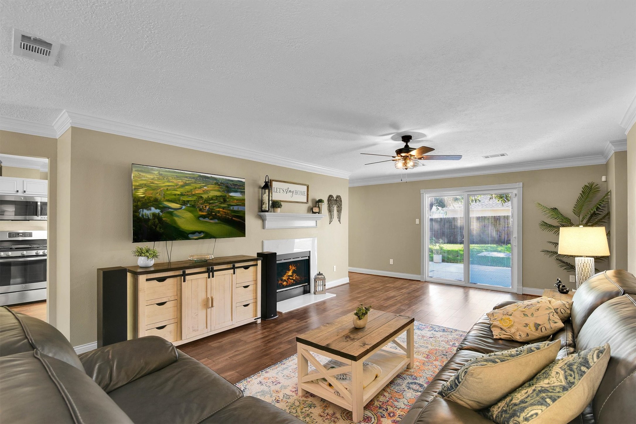 Spacious living room with gas log fireplace.