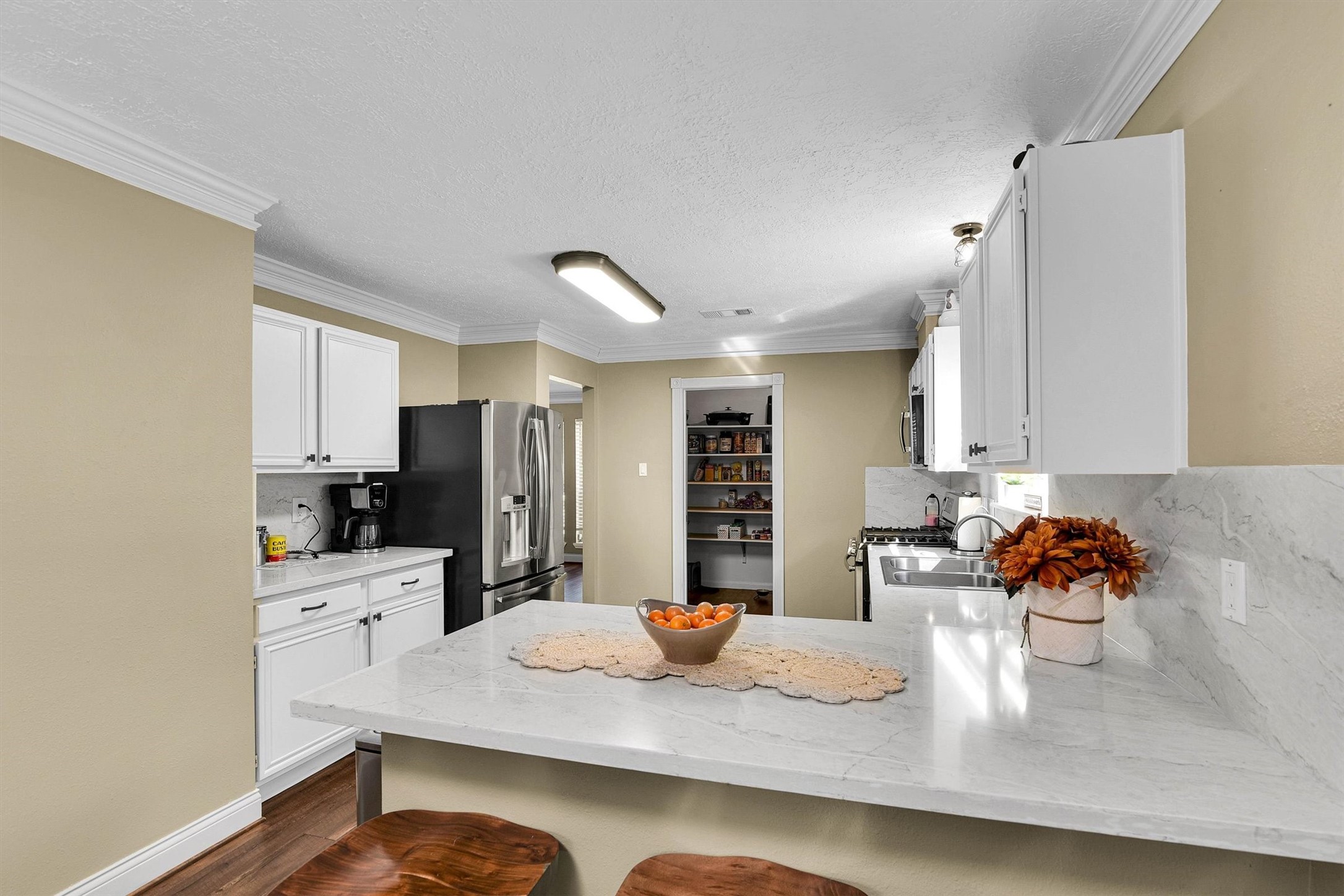 Extra storage cabinets and espresso bar.