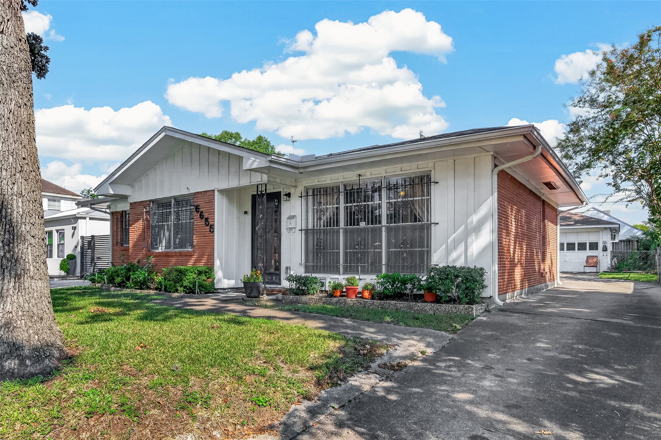 Double detached garage. Iron bars can be removed,owner purchased the house with Wrought Iron Installed.