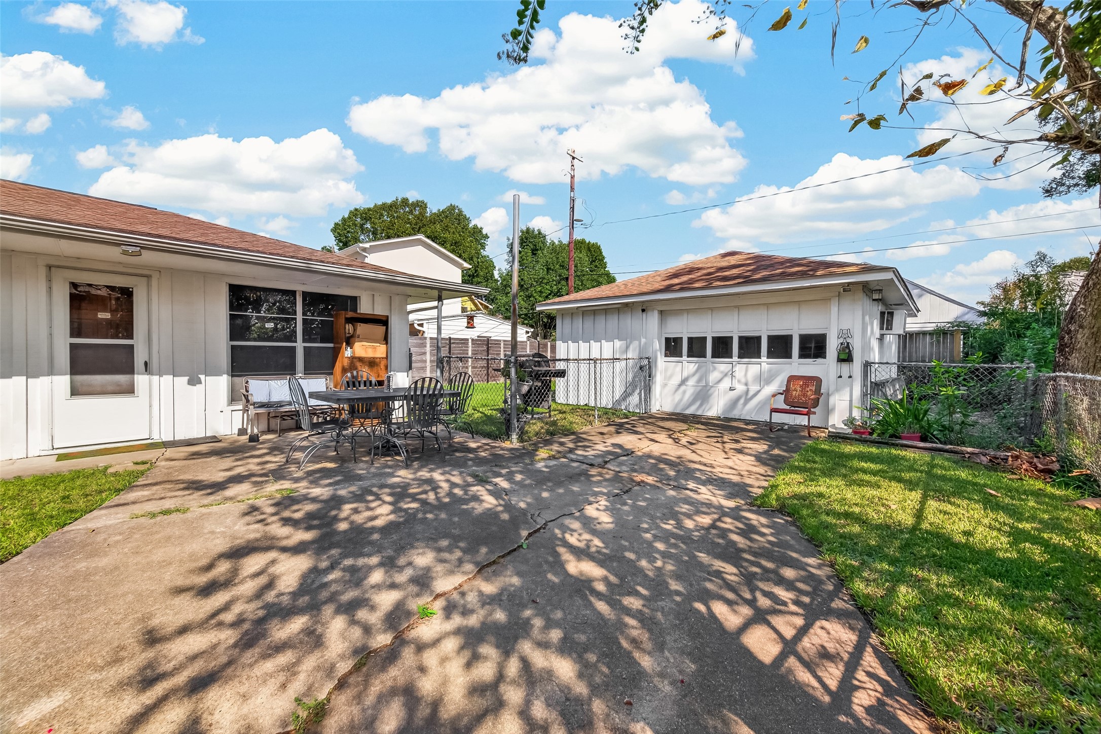 Side patio and single wide driveway to double car garage.Fully fenced back yard