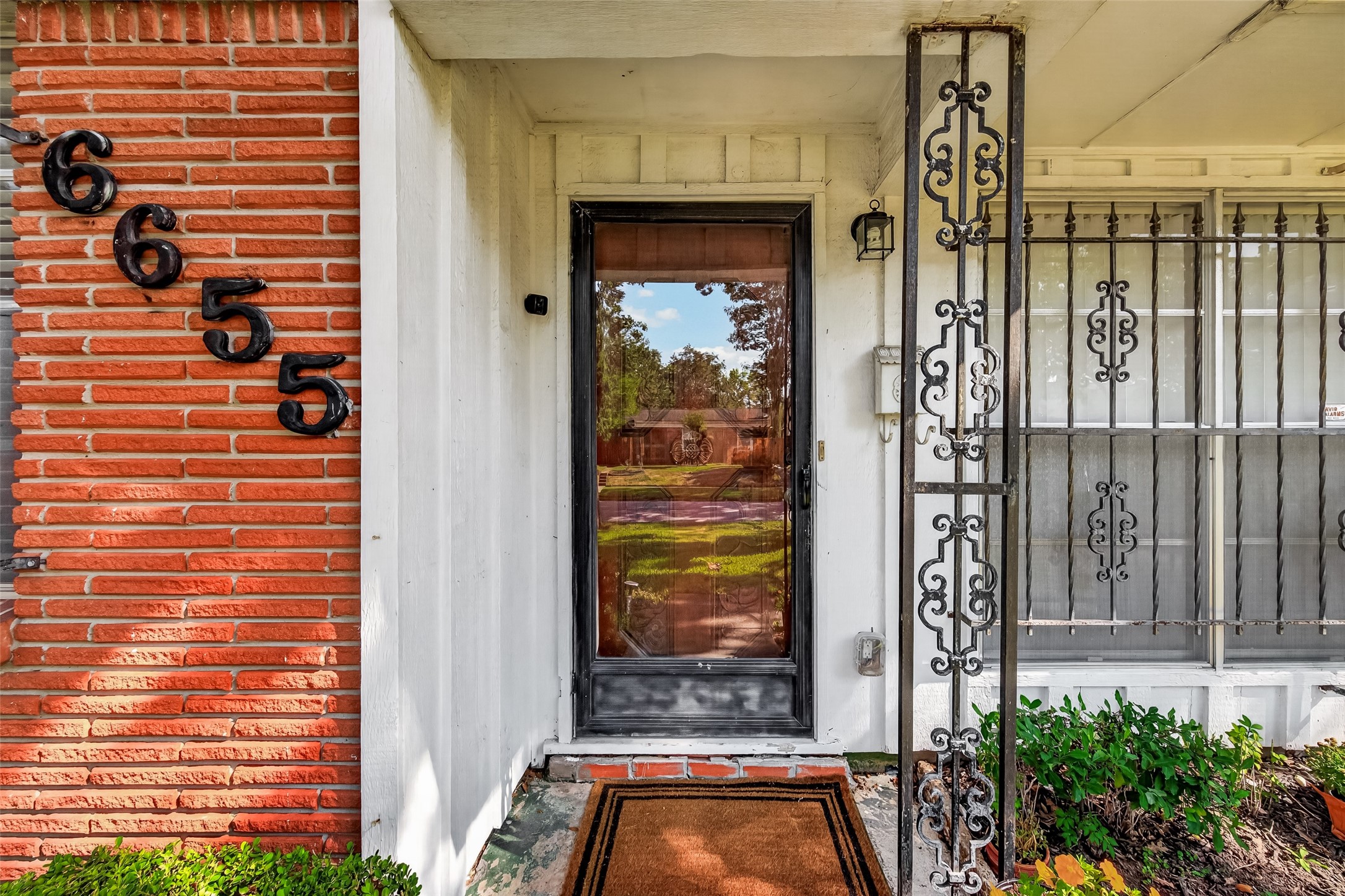 Welcome to 6655 Wildwood Way. Wrought Iron accents on windows can easily be removed.