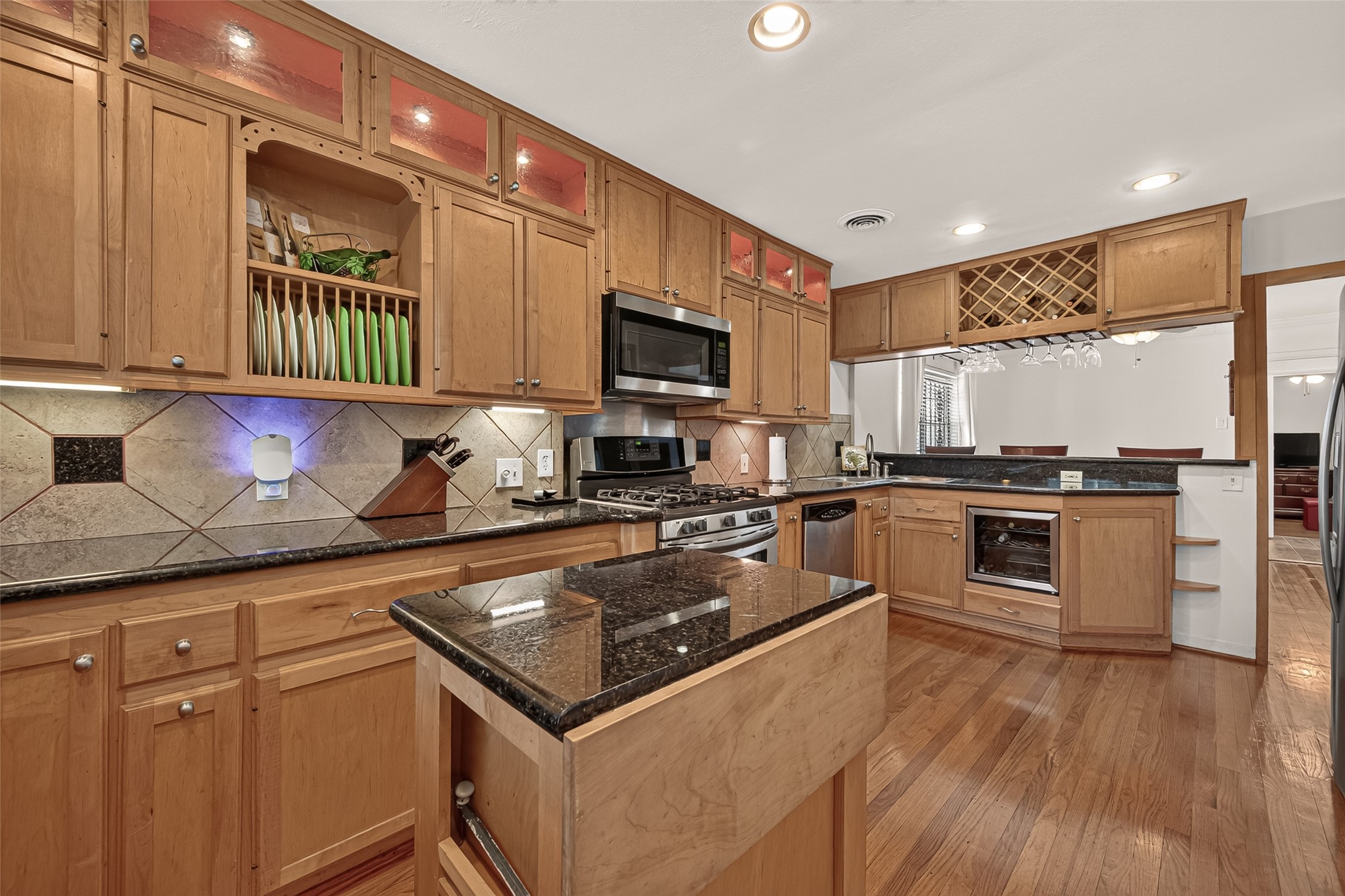 The unique rolling island can be stored in the pantry.