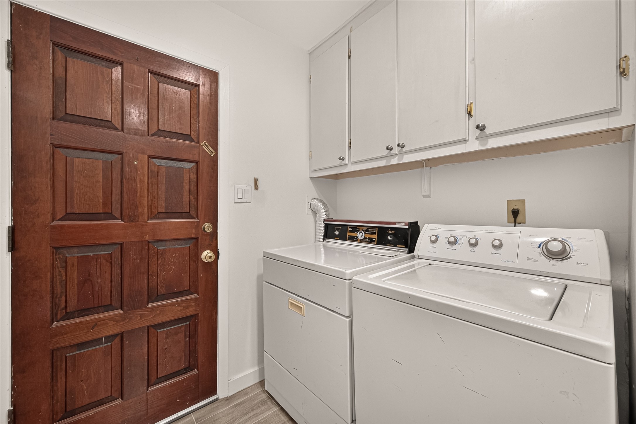 Laundry Room with access to the driveway.