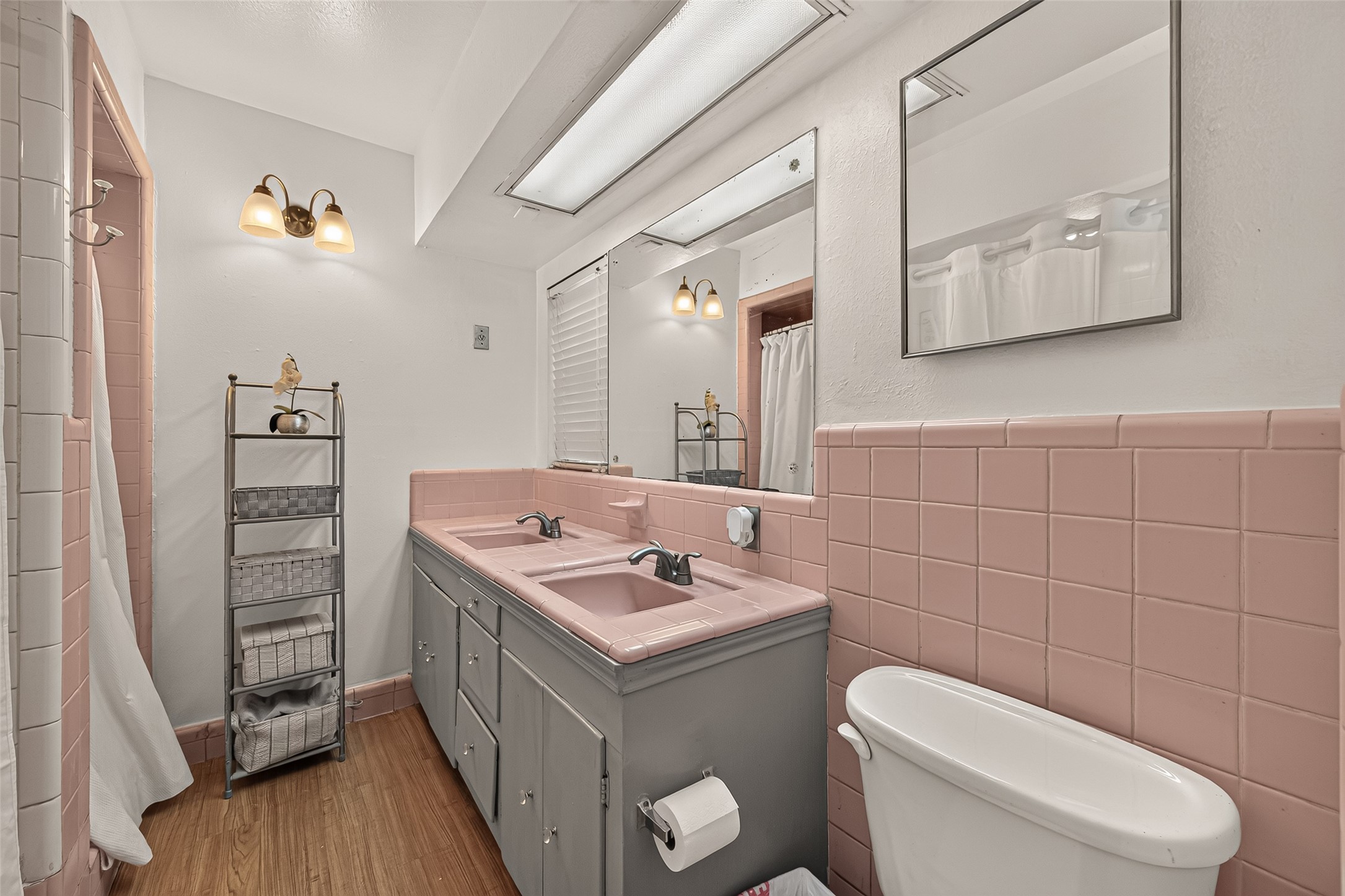 Nostalgic Original pink tile bathroom.