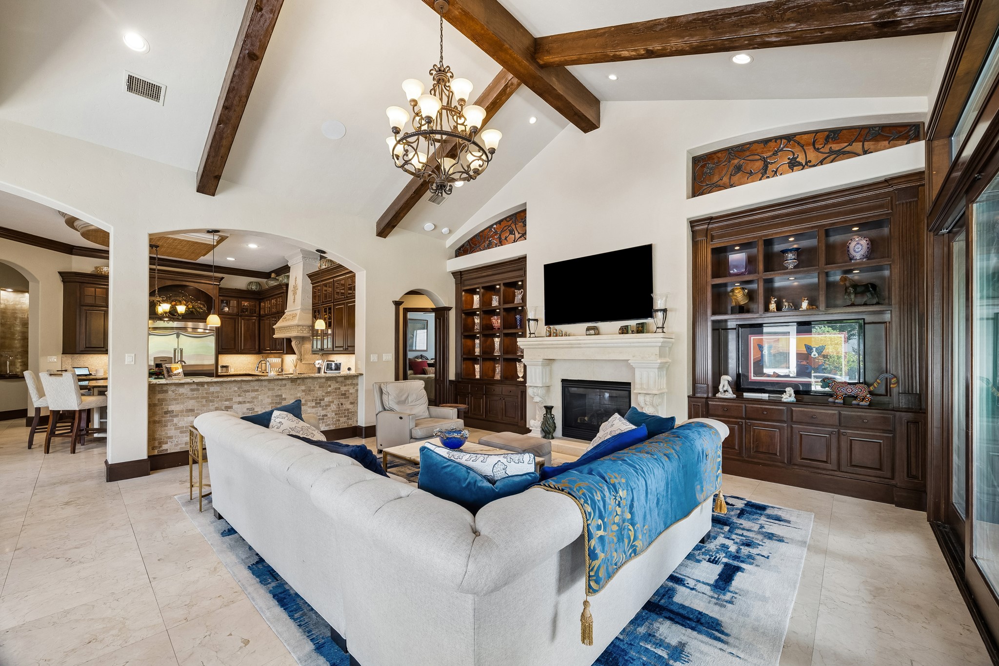 Another view of the family room looking back toward the kitchen. The vaulted ceiling and natural light are amazing!