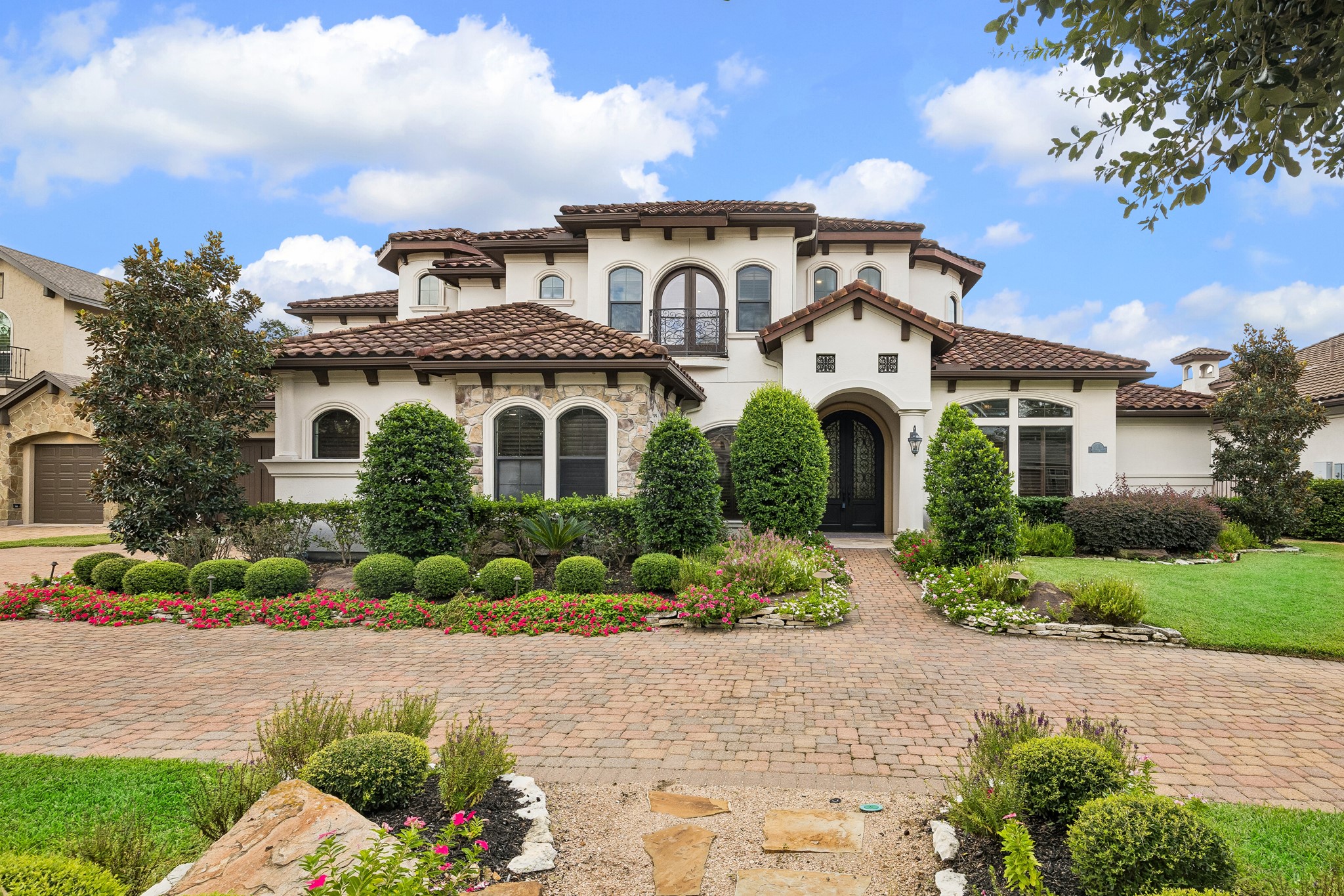 Step into this exquisite resort-style home in an exclusive sought-after gated community.