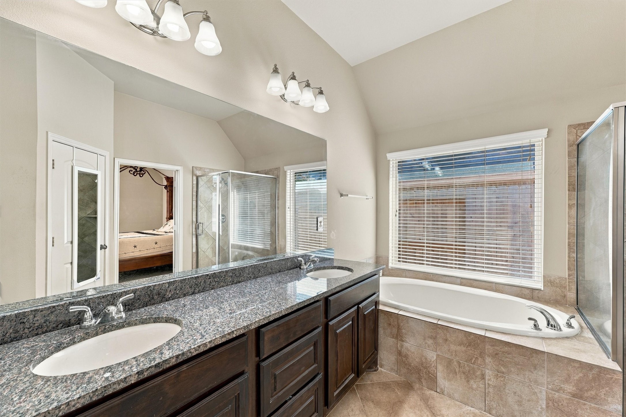 Primary bathroom suite with double sinks.