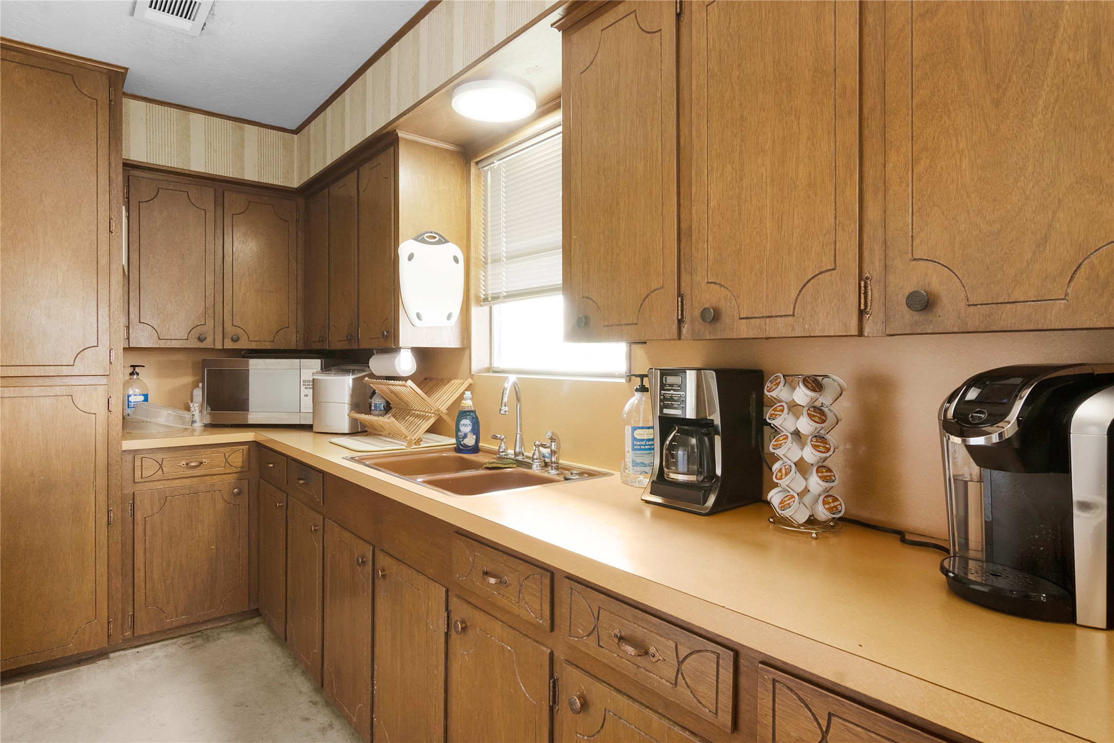 Another view of kitchen which has double sinks, a pantry and an incredible view from the kitchen window.