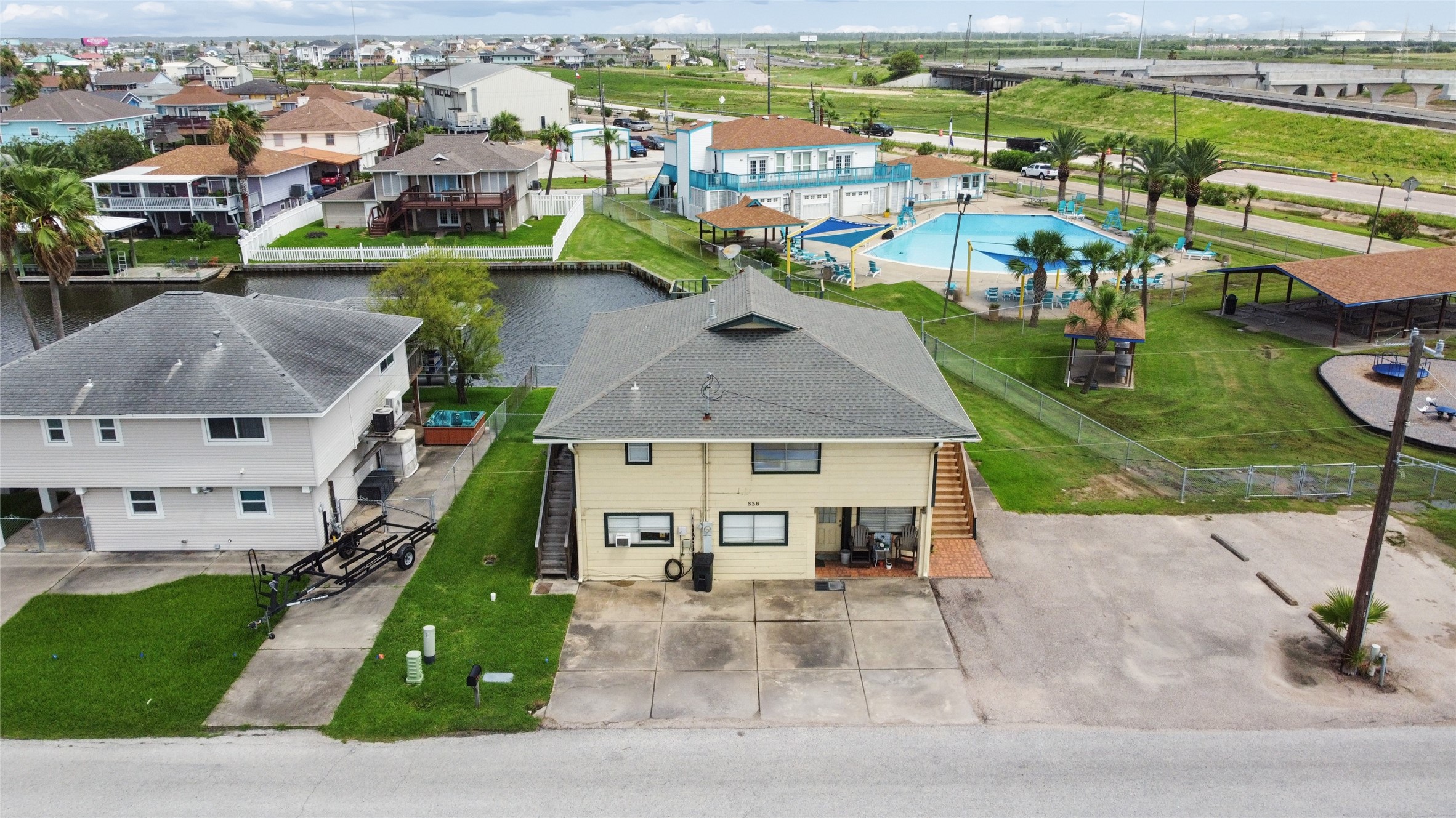 Ariel view of the home with the city pool and community center.  Garden Club meets second Tuesday of each month. Aerobic Swimming for adults in the summer each weekday morning.