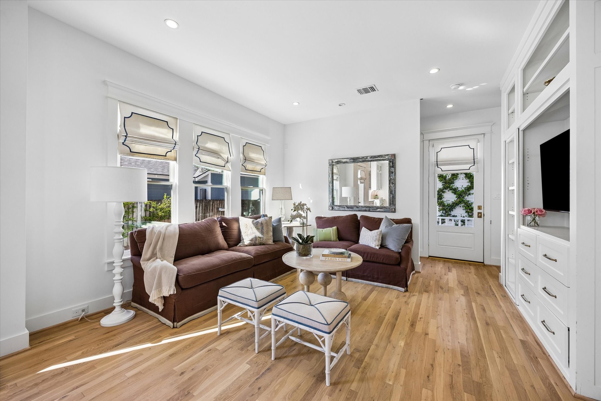 FAMILY ROOM WITH WALL OF BUILT INS