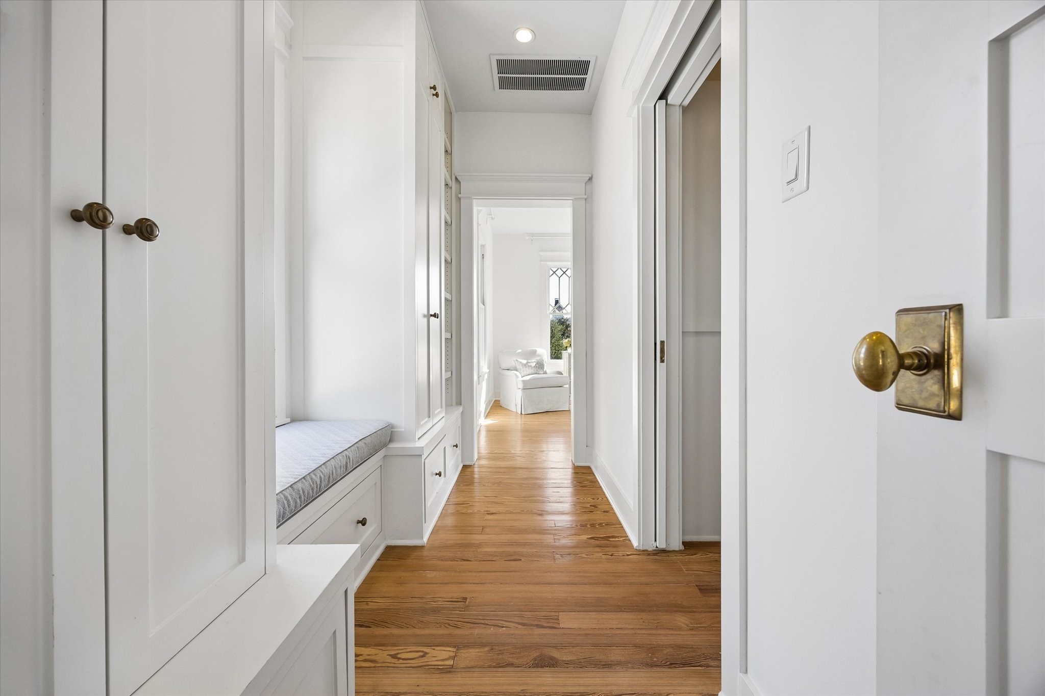 ENTRY TO PRIMARY SUITE OFFERS WINDOW SEAT AND LARGE WALK IN CLOSET