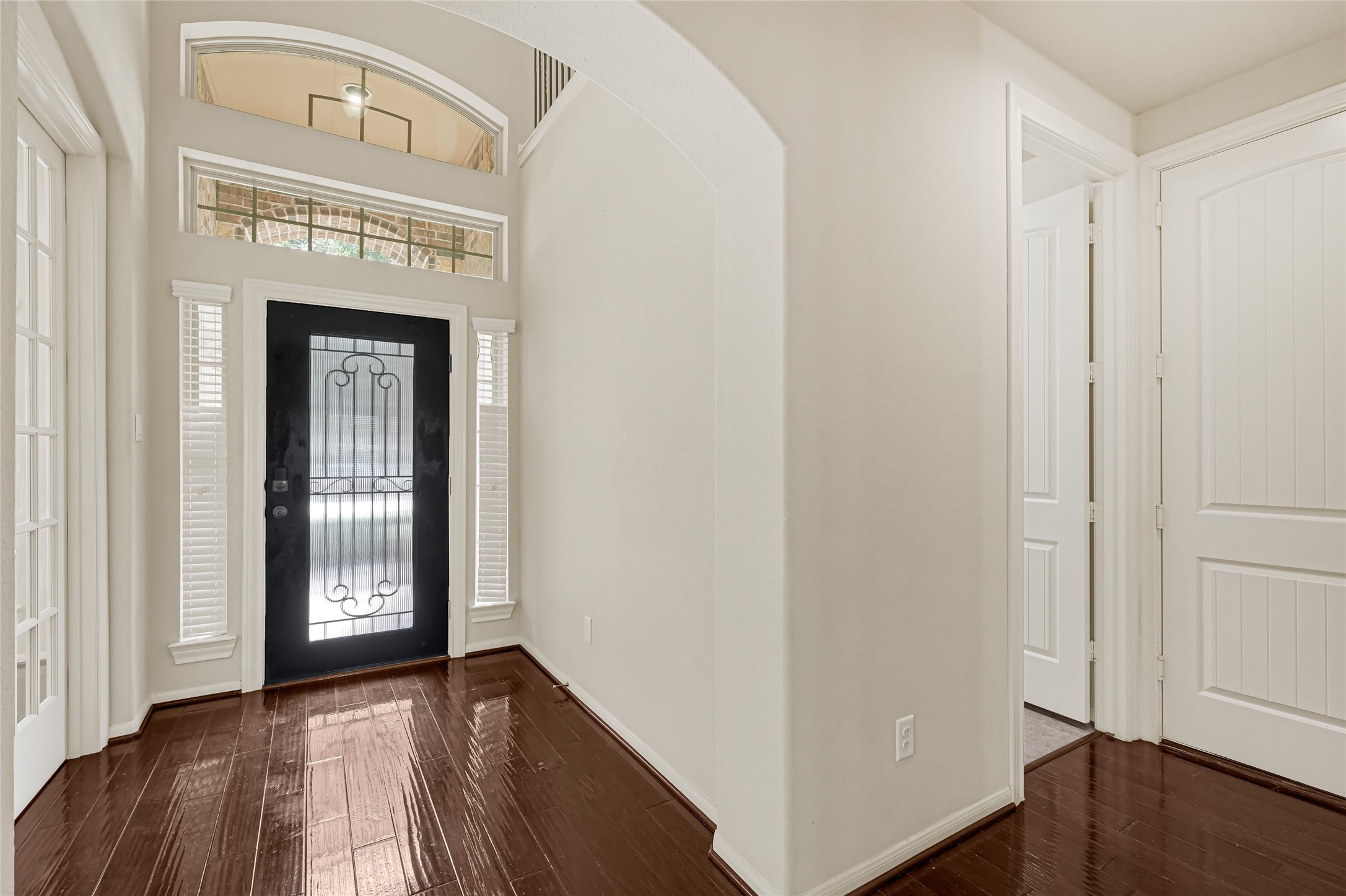 Light-filled entryway with hardwood flooring, neutral walls, and convenient access to adjoining rooms. Light-filled entryway with hardwood flooring, neutral walls, and convenient access to adjoining rooms.