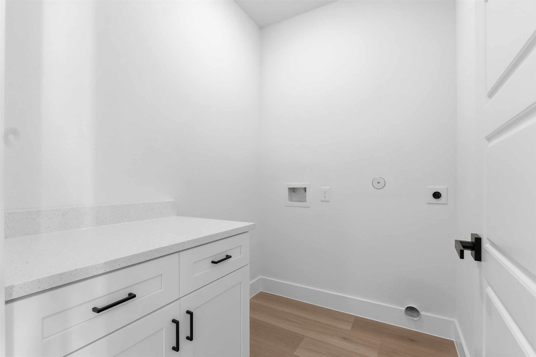 Downstairs laundry area with folding station